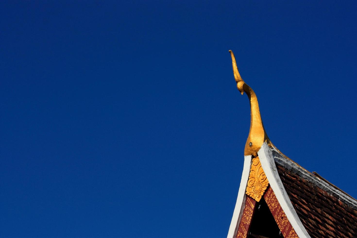 The top front of temple roof decoration in Laos photo