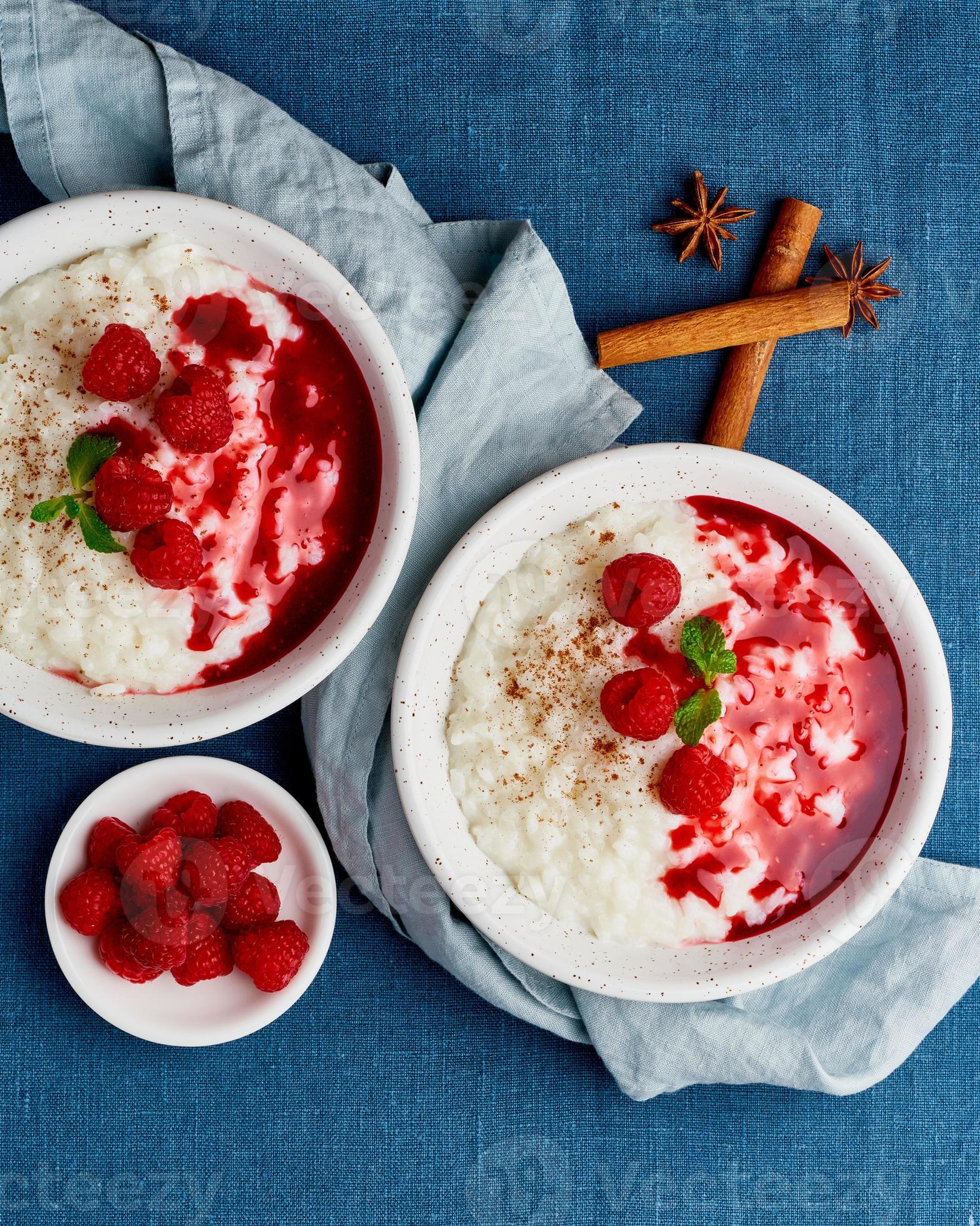 Two rice pudding. French milk rice dessert with raspberries