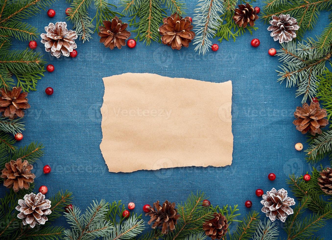 Christmas and Happy New Year dark blue background with craft paper for text. Frame for recipe photo