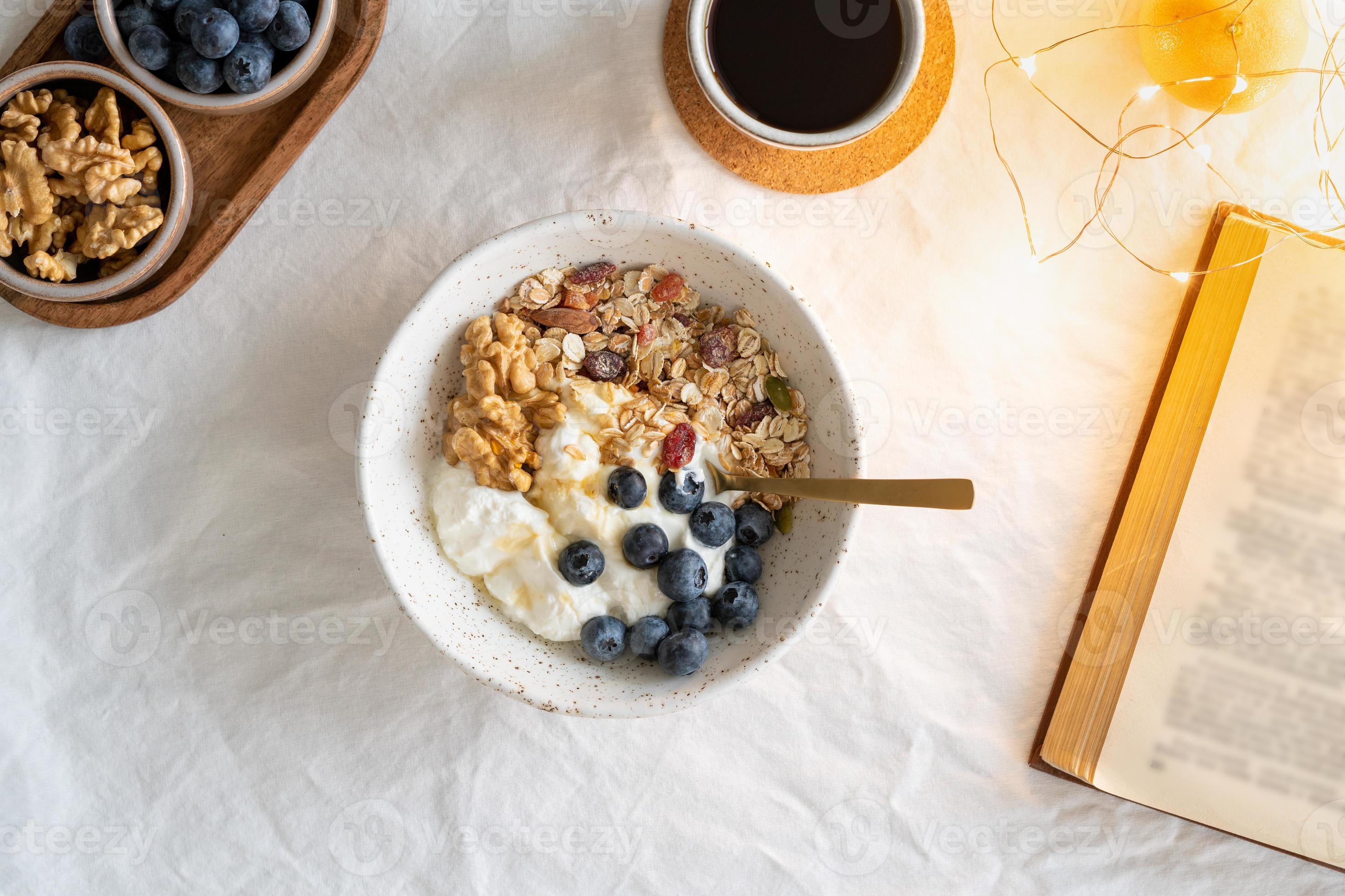 Top view book and Christmas healthy lifestyle breakfast with granola