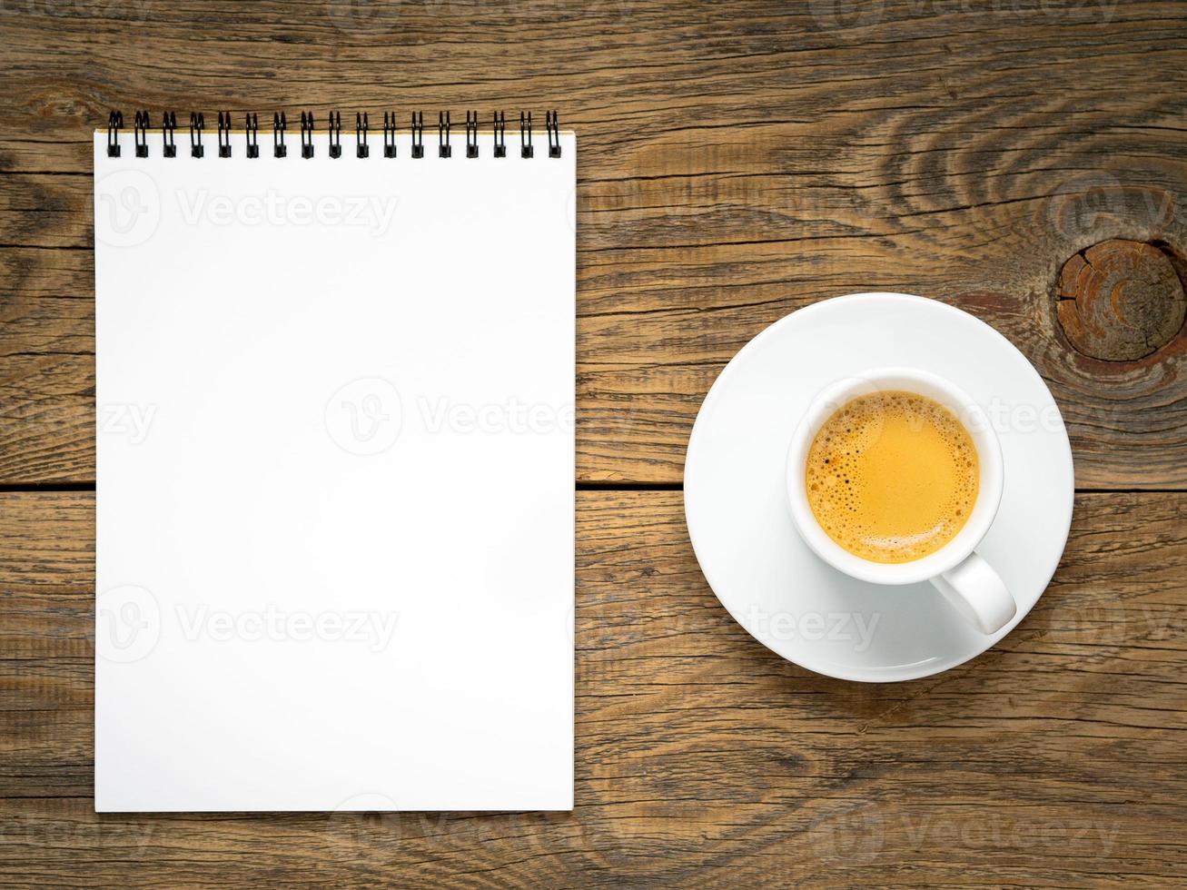 Notepad open with blank page for writing idea or to-do list photo