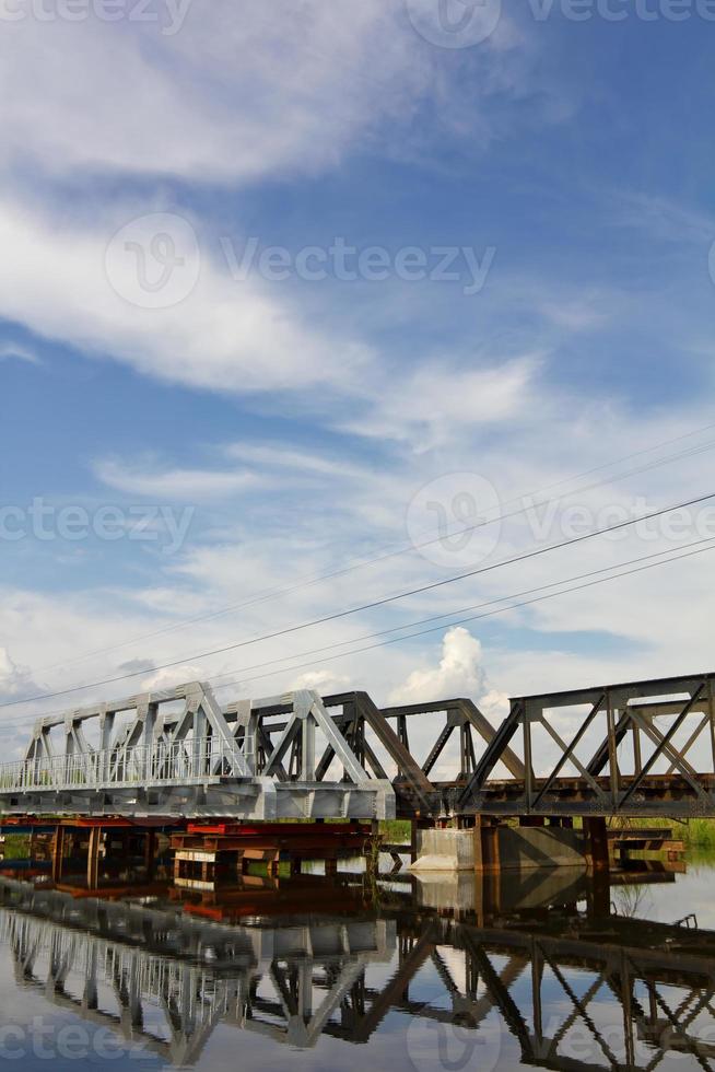 Repair added a new railway bridge reflection water. photo