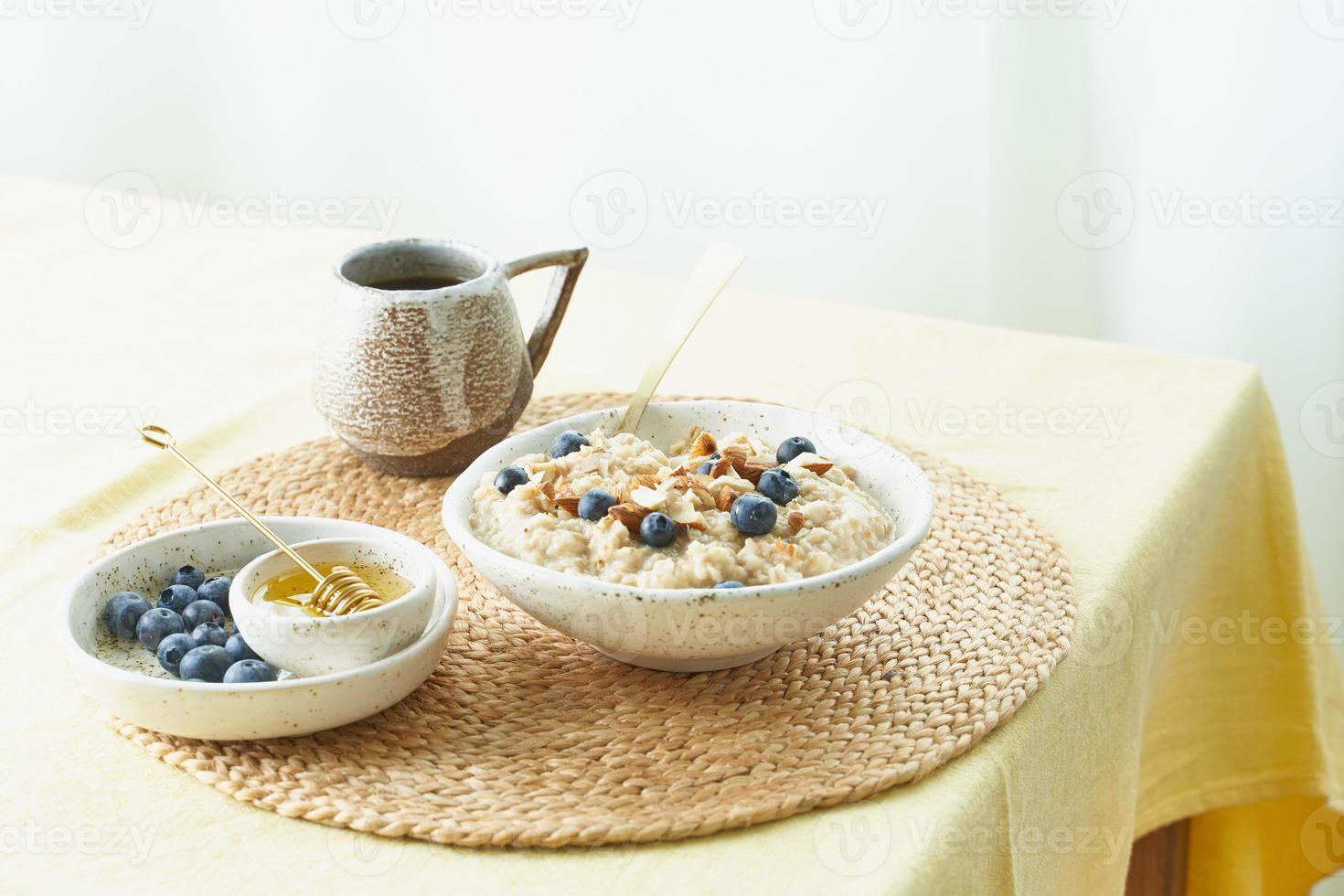 Breakfast, oatmeal porridge with berries and nuts, healthy food, proper nutrition. photo