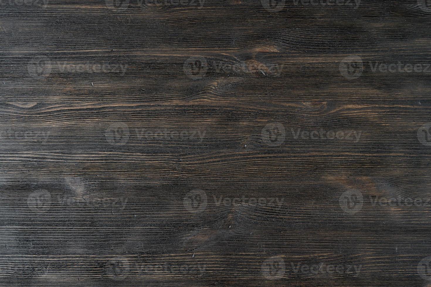 patrón de fondo de madera de textura marrón negro oscuro. textura de madera natural, madera rústica de pino foto