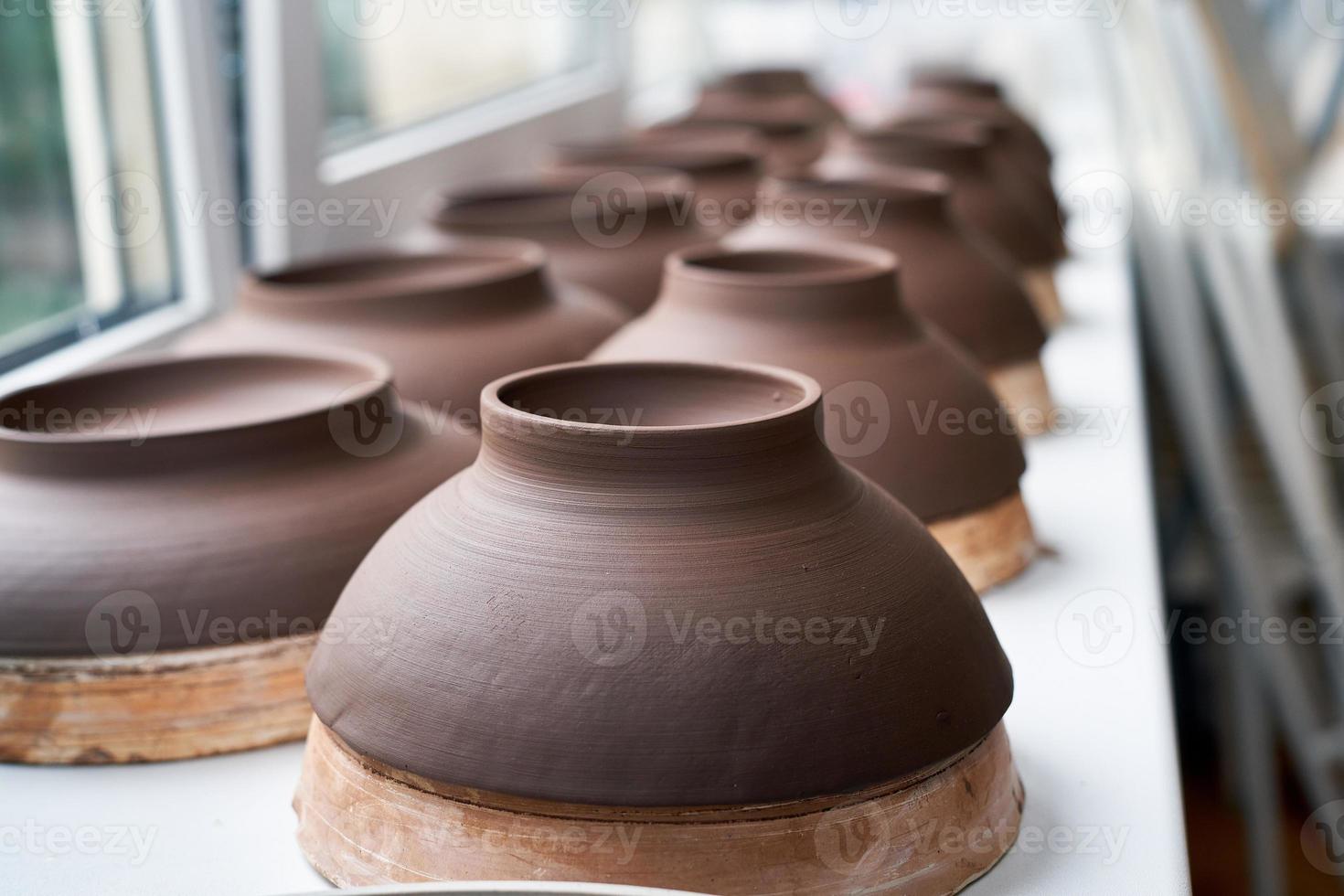 Manufacture of ceramic products, workpiece. Close up background with ceramic pieces. Soft focus photo