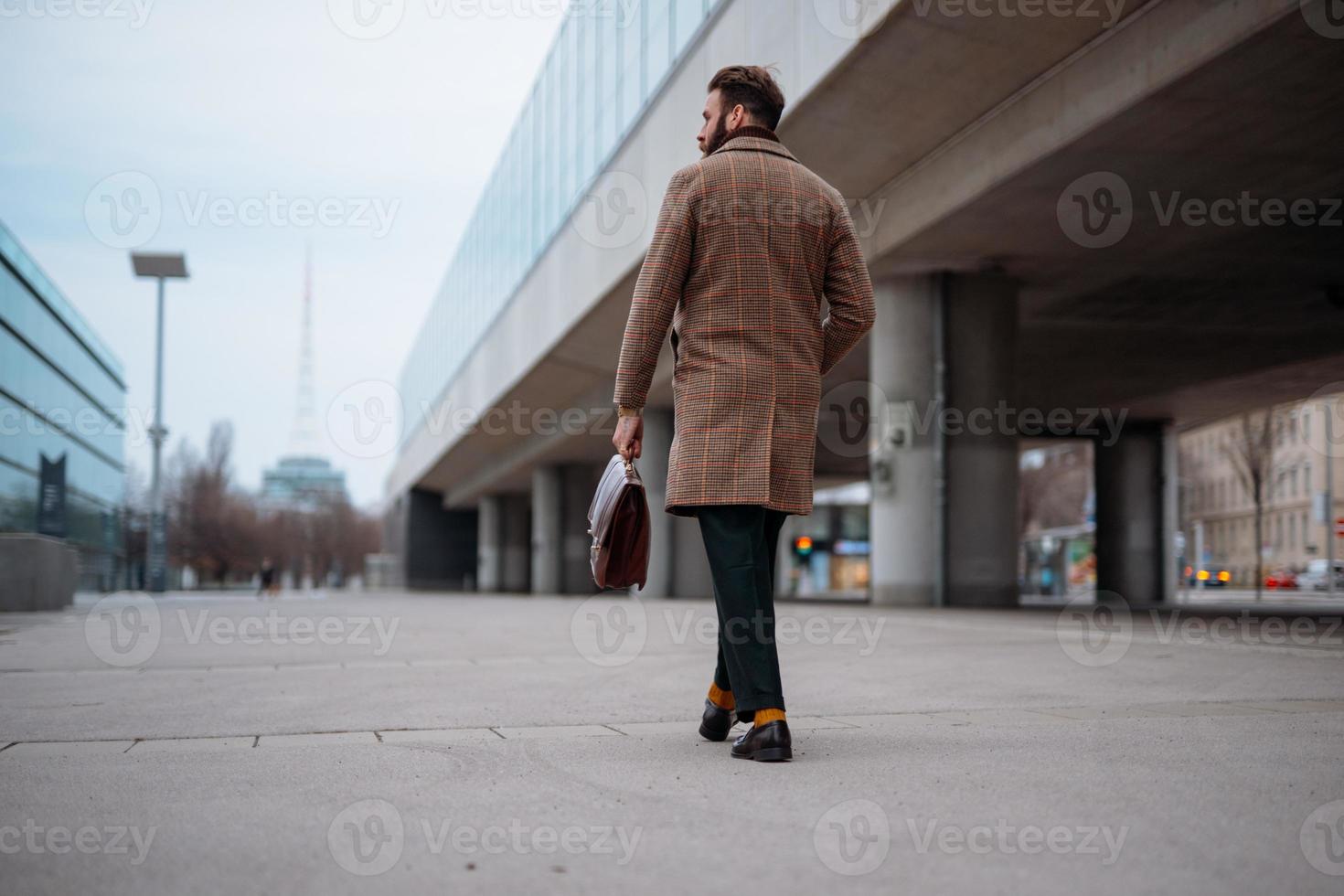 Businessman going to work by walk. Commuting to the Office. Public transport photo