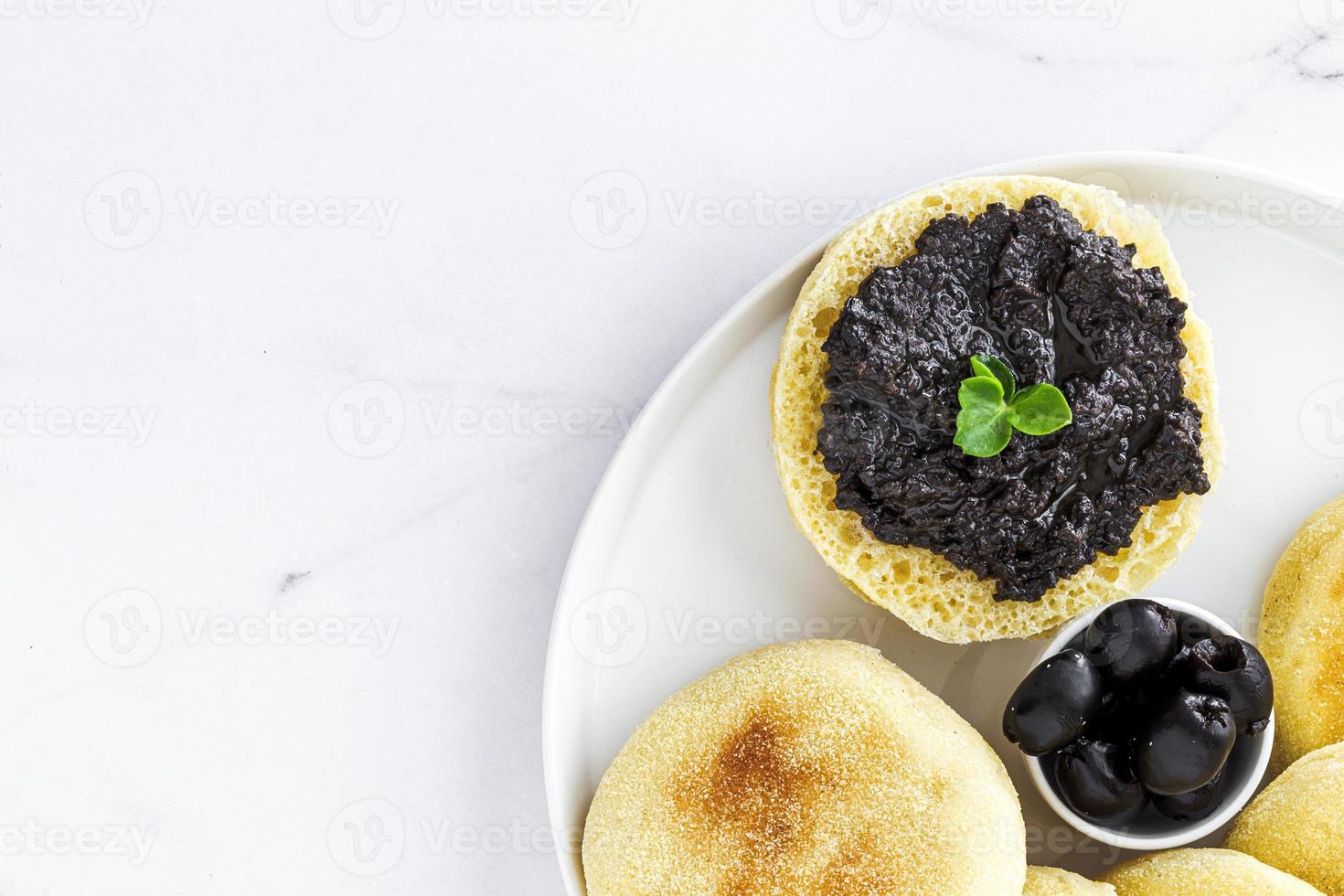 Homemade harcha semolina bread pancakes with olives mashed photo