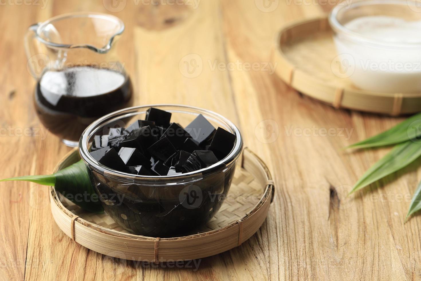 Black Grass Jelly Cincau Hitam, Indonesian Dessert Made from Cincau Leaf with Coconut Milk and Palm Sugar photo