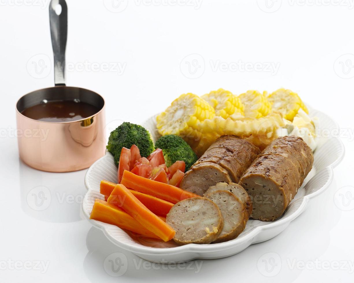 Baked Meatloaf with Boiled eggs and Vegetable, Served with Mushroom Barbeque Sauce photo