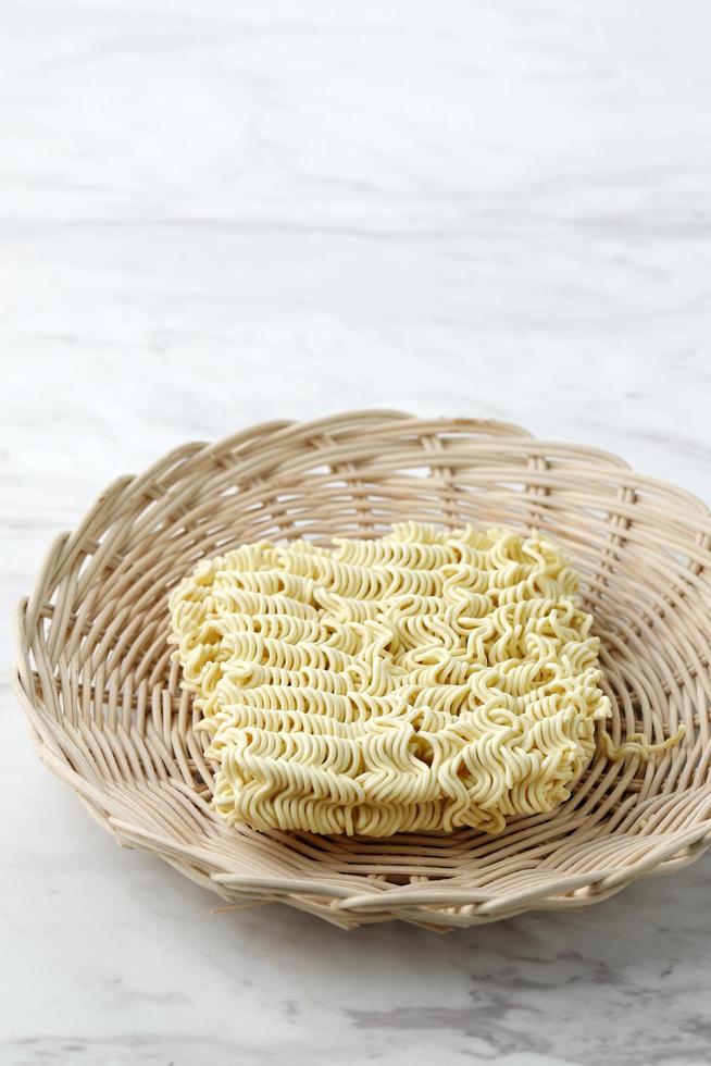Asian  Dried Instant Noodle on Bamboo Plate photo