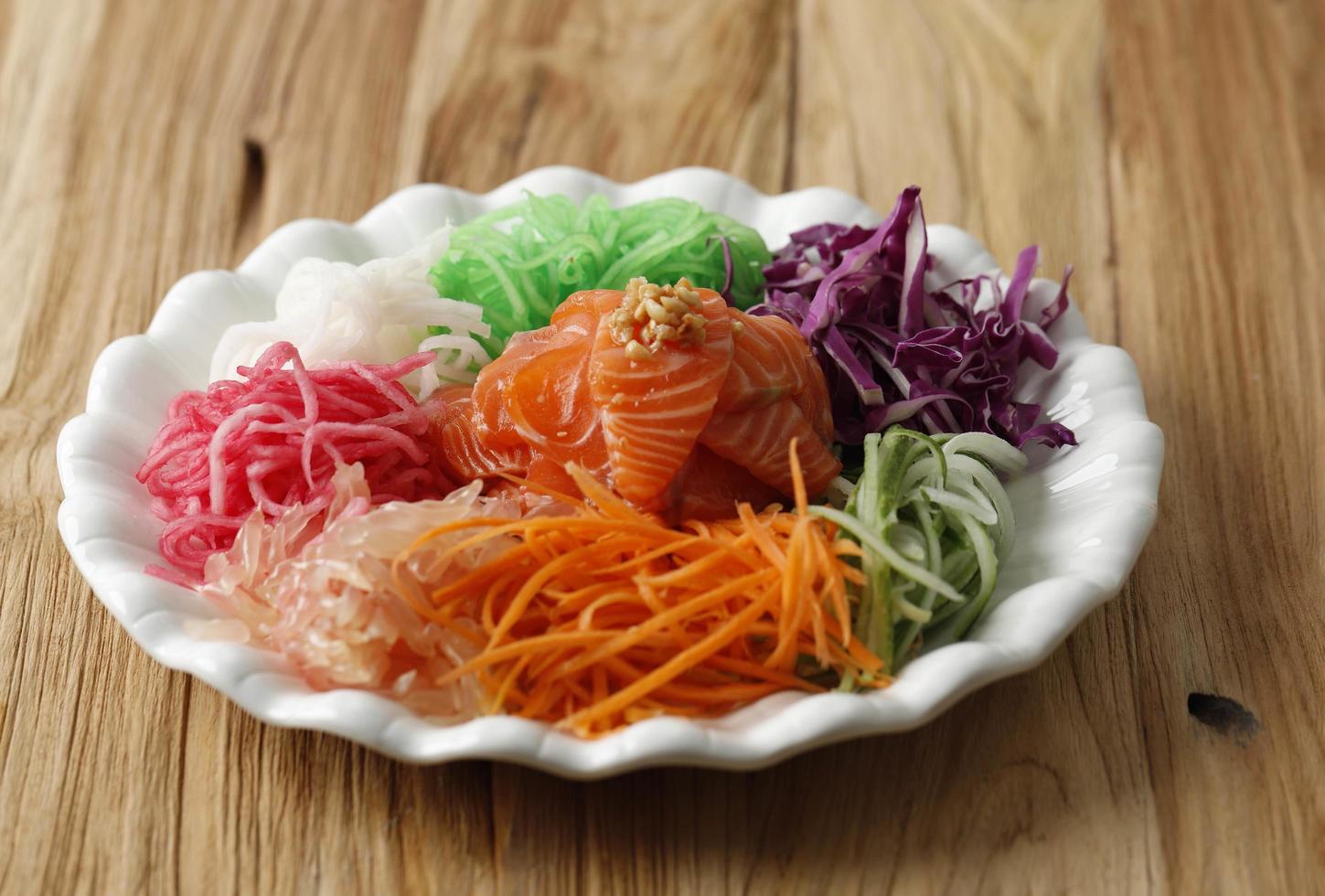 Salmon Yee Sang or Yusheng, a Chinese New Year Celebration Dish photo