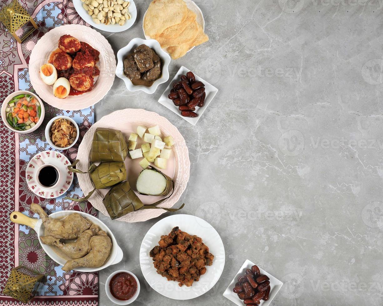 Ketupat Lebaran Ied Menu Dish, Opor Ayam, Sambal Goreng Ati Kentang, Balado Telur, Dates Fruit, Sambal, and Tea. photo