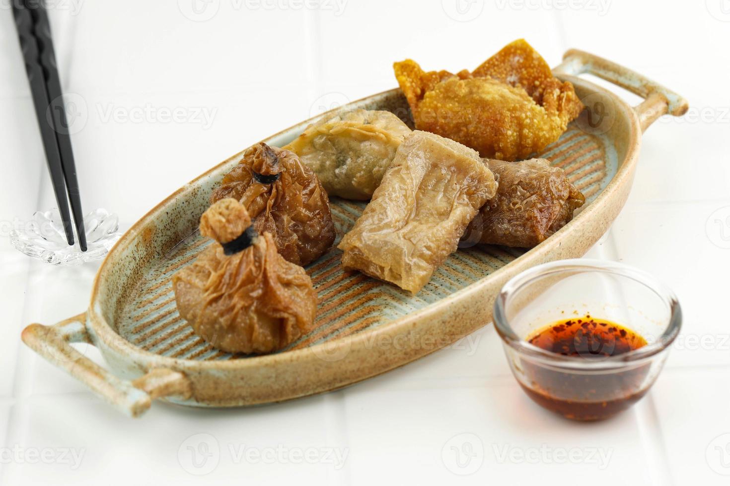 Deep Fried Dim Sum, Ekado, Lumpia on Rustic Oval Plate, photo