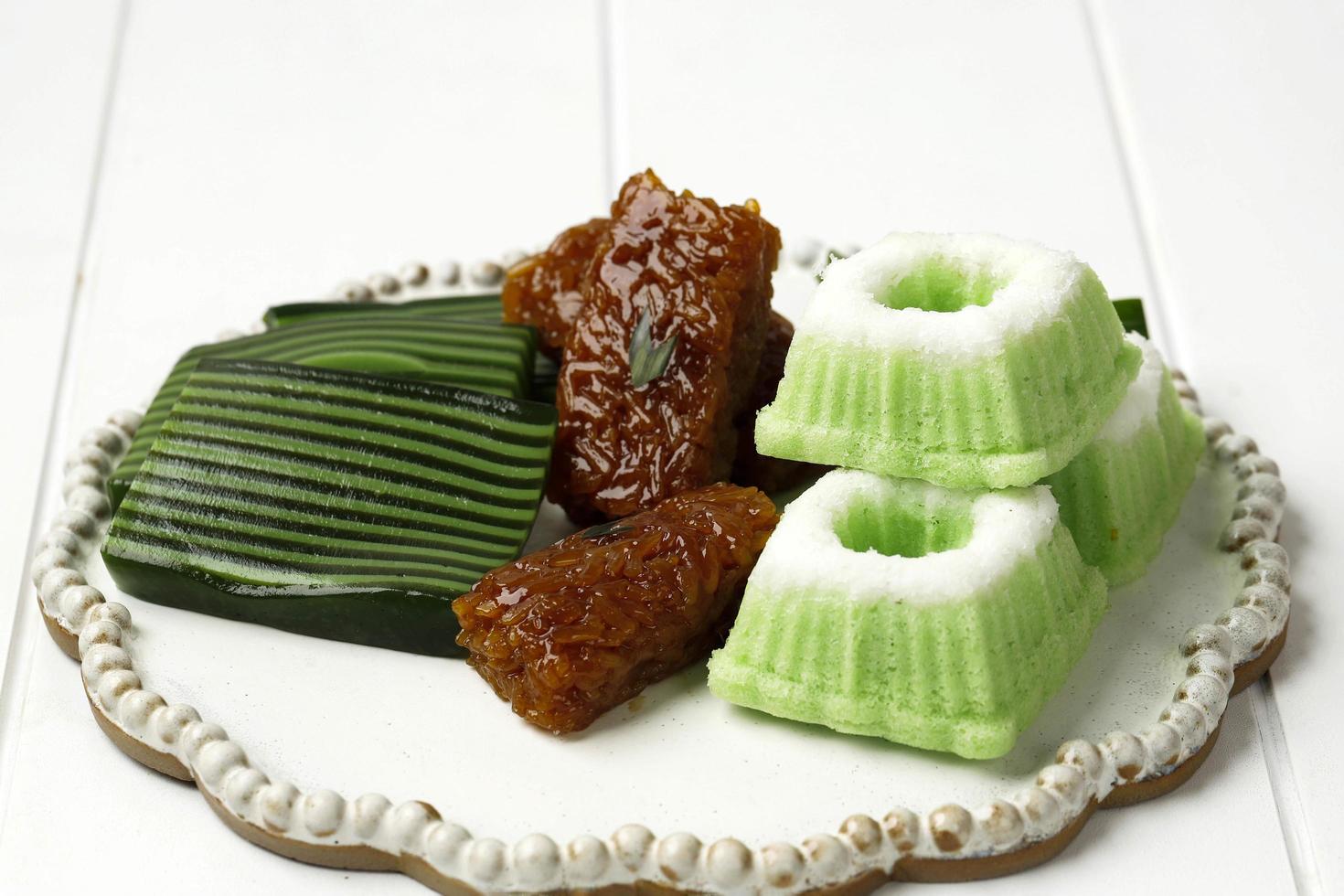 Three Various Jajan Pasar, Indonesian Traditional Snack for Tea Time, Kue Putu Ayu, Wajik, and Kuih Lapis Beras photo