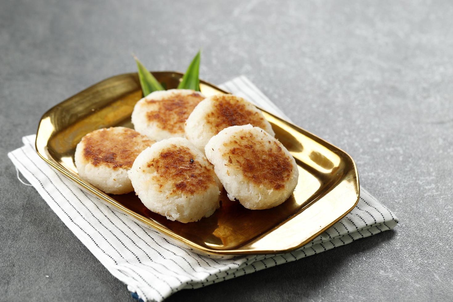 Round Wingko Babat, Traditional Indonesian Snack Made from Glutinous Rice Flour, Sugar, and Grated Young Coconut. photo