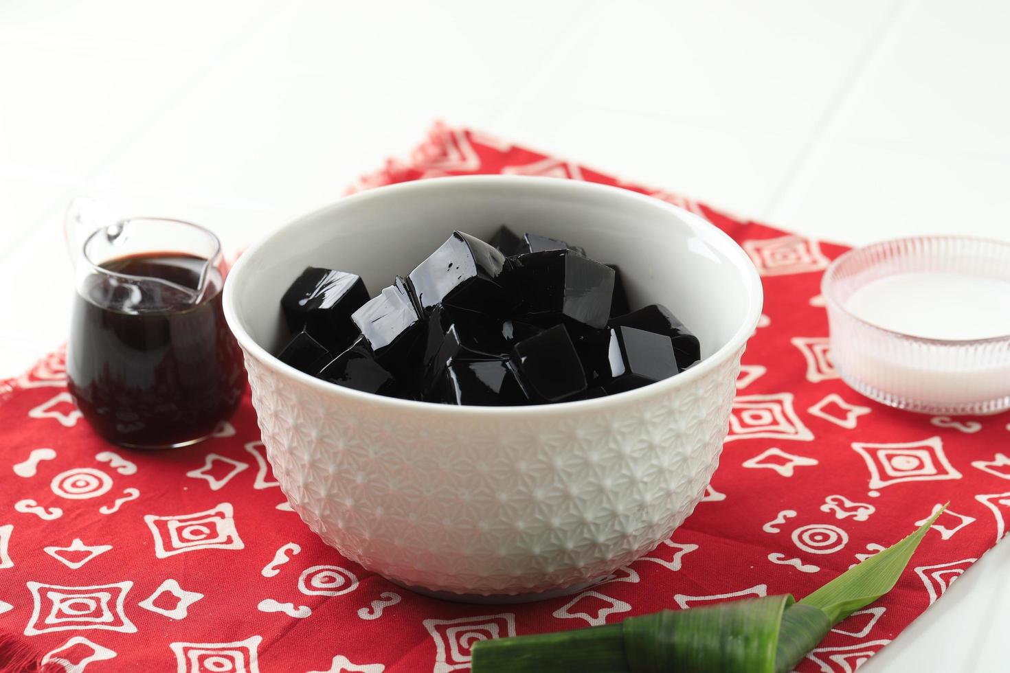 Diced Black Grass Jelly Cincau Hitam, Indonesian Dessert Made from Cincau Leaf, Usually Eat  with Coconut Milk and Palm Sugar Syrup. photo