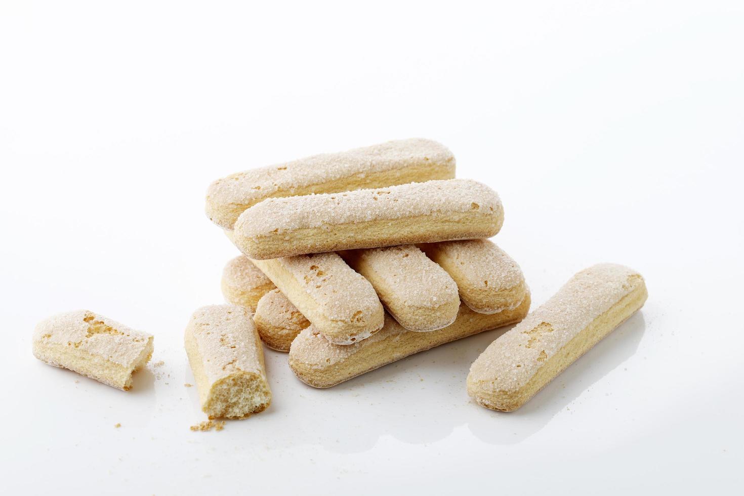 Stacked Italian Cookie Savoiardi. Sweet Biscuits. Sponge Cookies for Tiramisu Isolated on White Background. photo