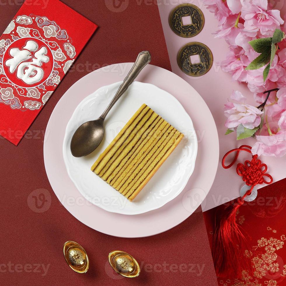 Lapis Legit, Indonesian Traditional Thousand Layered Cake with Chinese New Year Red Concept. photo