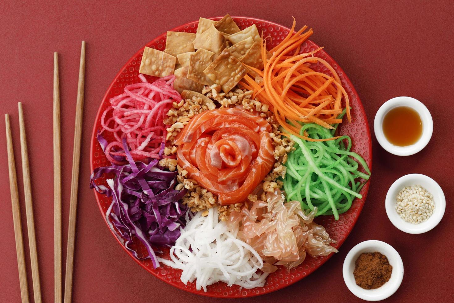 Yee Sang Chinese New Year Dinner for Prosperity Toss Celebration also known by Yu Sheng Spring Toss. photo