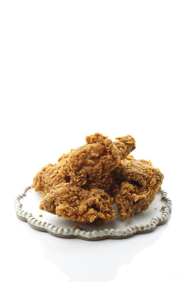 hot and crispy fried chicken legs isolated on a white background photo