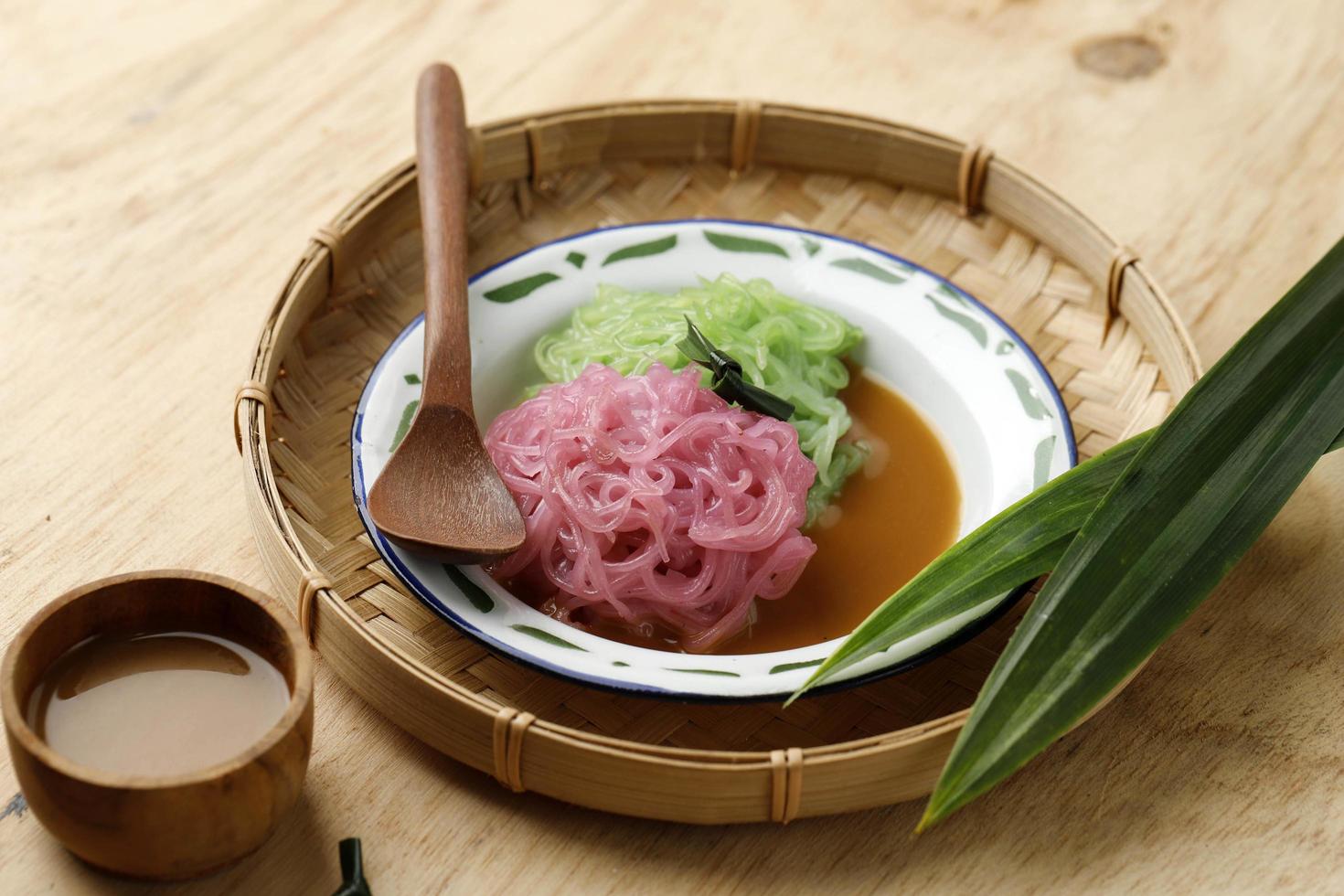 Putu Mayang or Petulo, Indonesian Traditional Javanese Snack Made of Rice Flour Strands Curled up into a Ball with Food Coloring photo