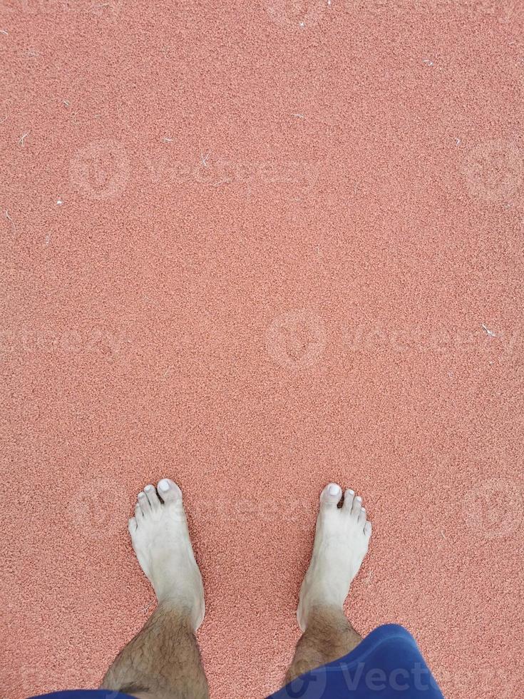 The barefoot running on tracks. photo