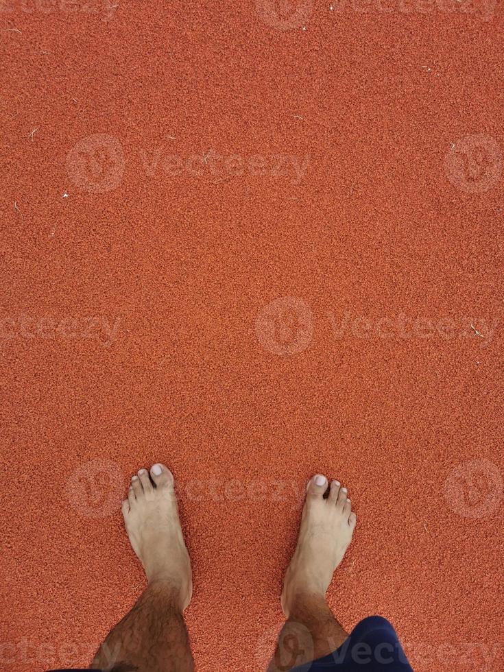 The barefoot running on tracks. photo