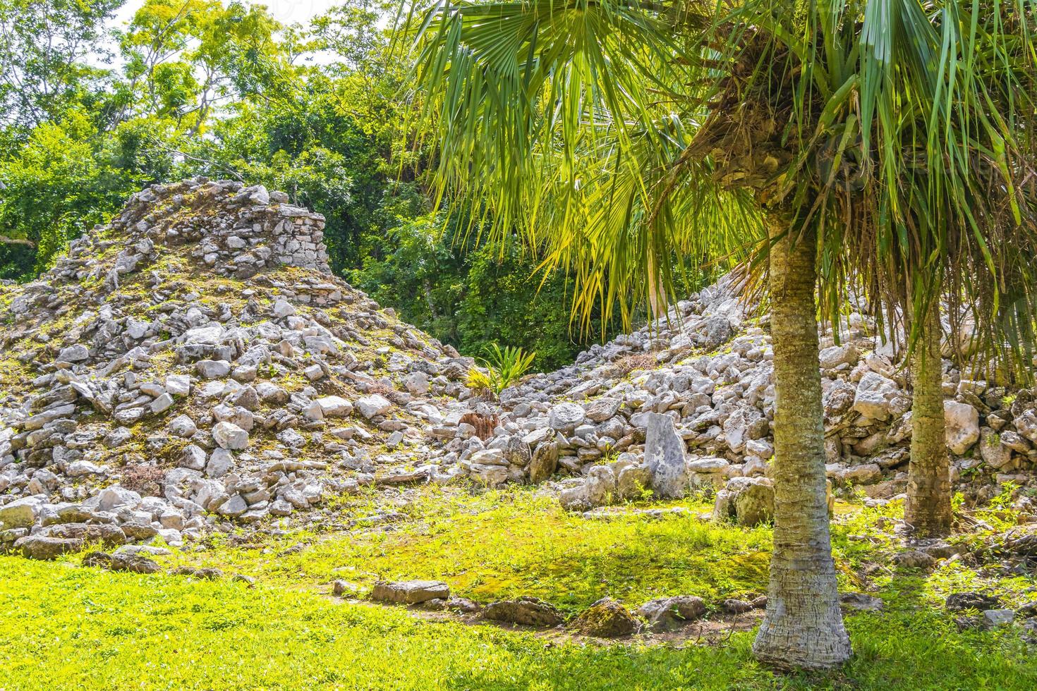 Ancient Mayan site with temple ruins pyramids artifacts Muyil Mexico. photo