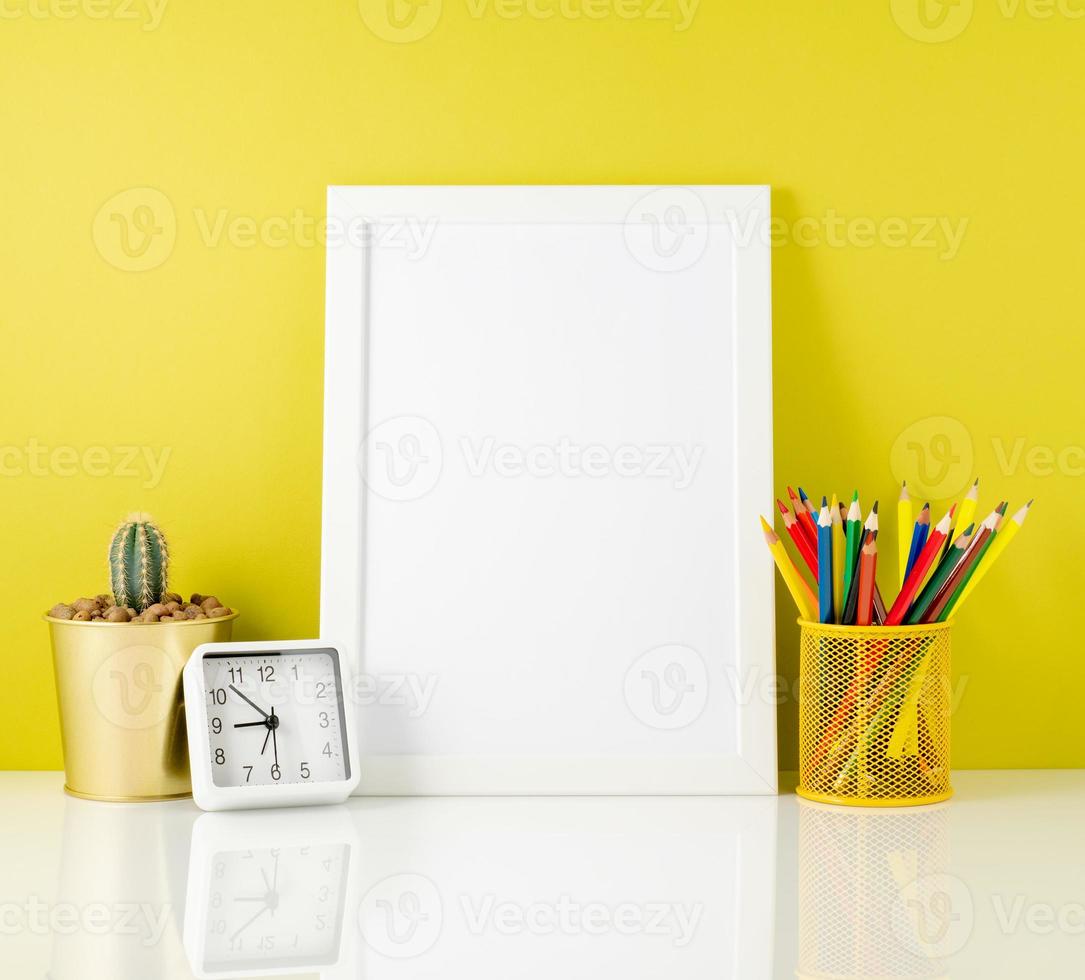 Mockup with clean white frame, colored pencils on the bright yellow background. Concept for creativity, drawing. photo