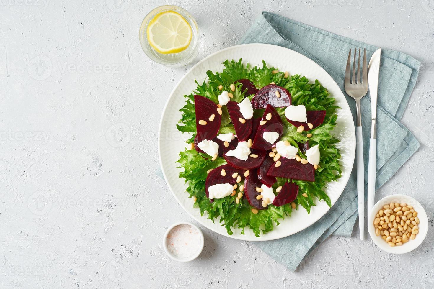 salad with beet, curd, feta, ricotta and pine nuts, lettuce. Healthy keto ketogenic dash diet