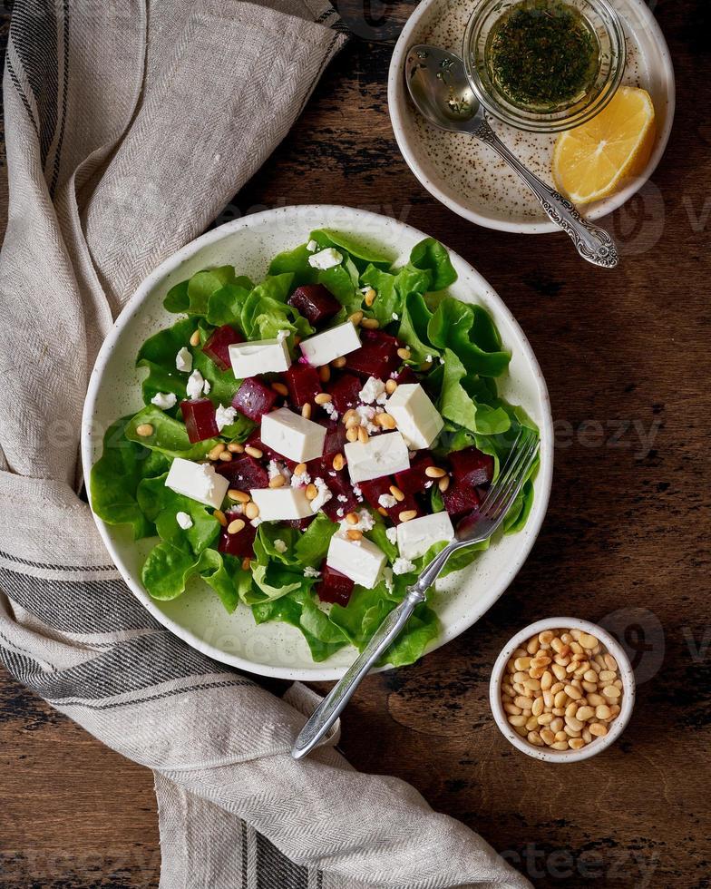 Healthy salad with beet, curd, feta and pine nuts, lettuce. Low carb keto ketogenic dash diet