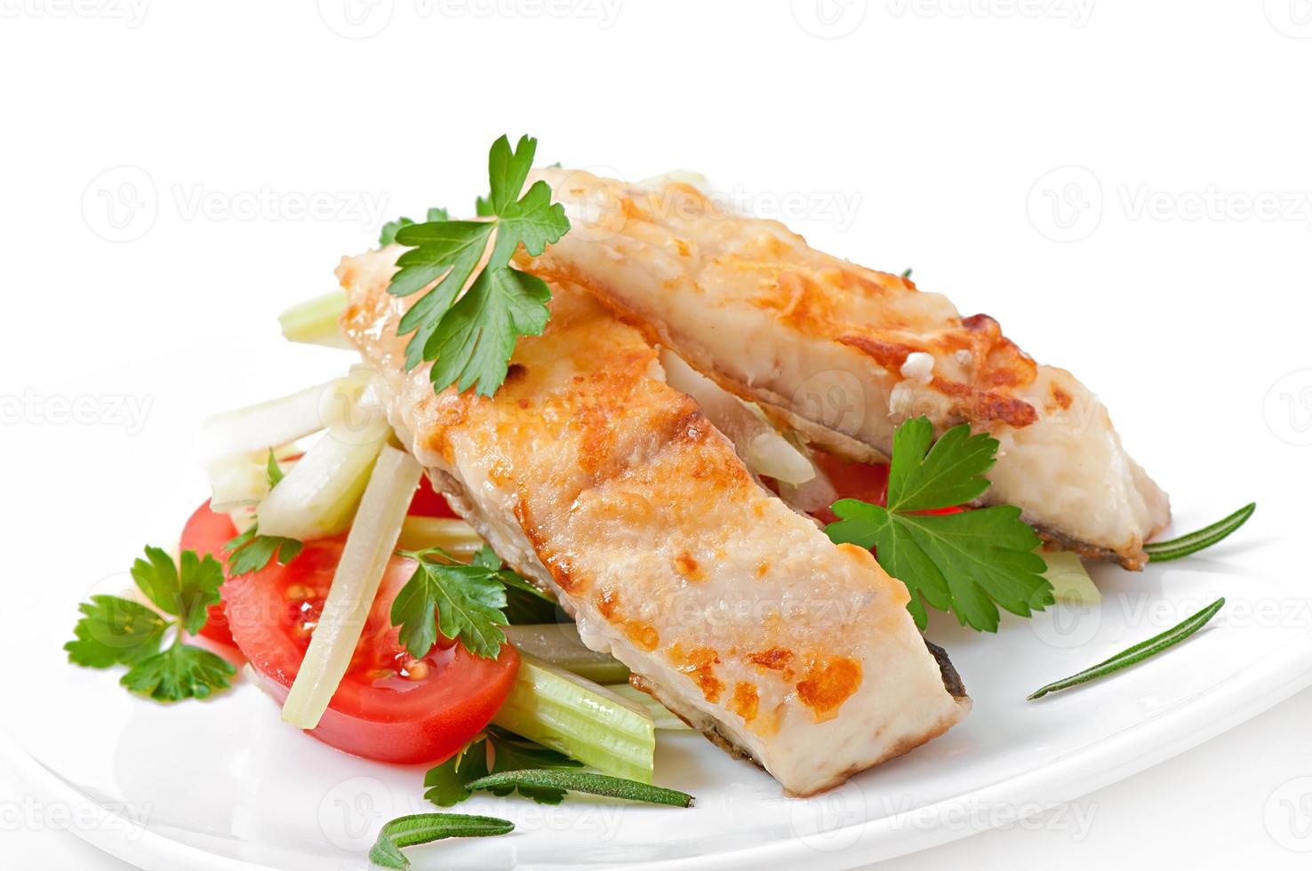 Fried filet fish and fresh vegetable salad photo