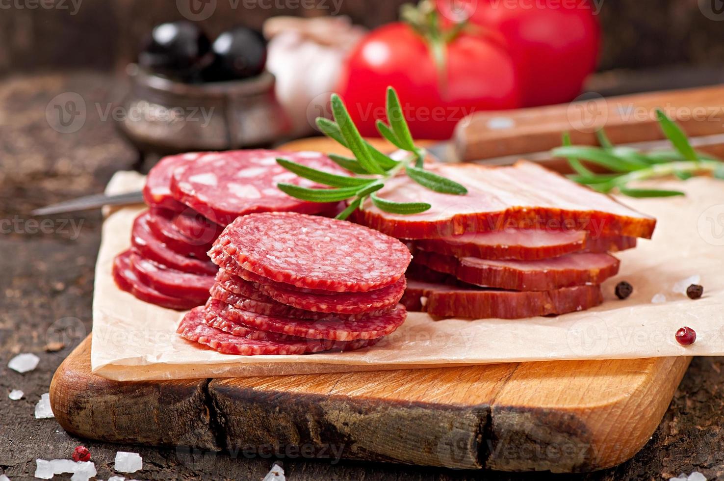Assorted deli meats, rosemary and pepper 7195675 Stock Photo at Vecteezy