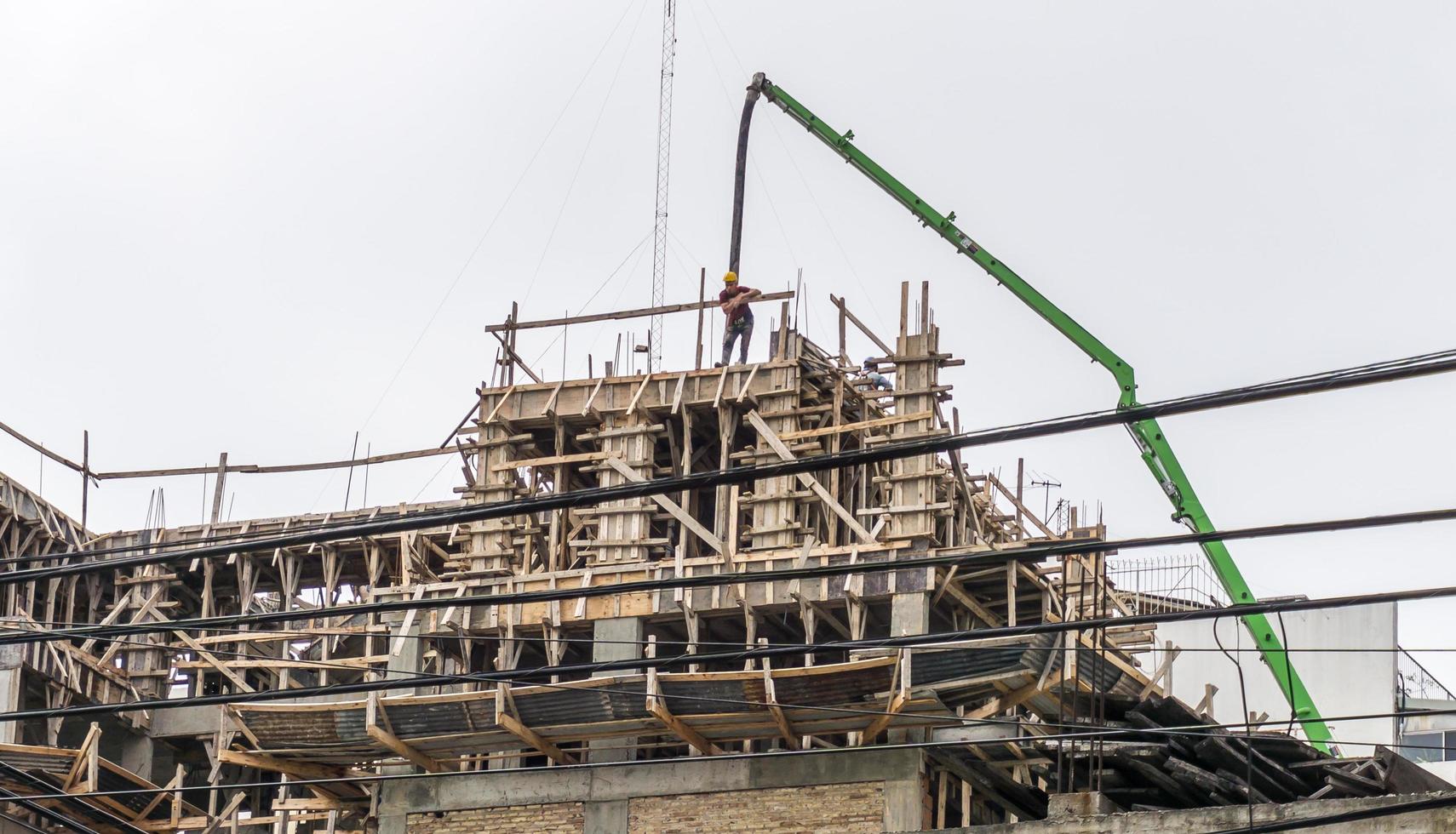 Buenos Aires, Argentina. 2019. Construction worker unloading cement photo