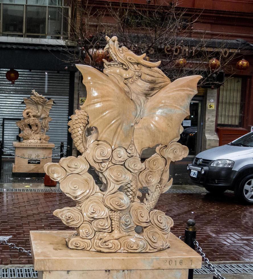 Buenos Aires, Argentina. 2019. Two statue of dragons in both sidewalks photo