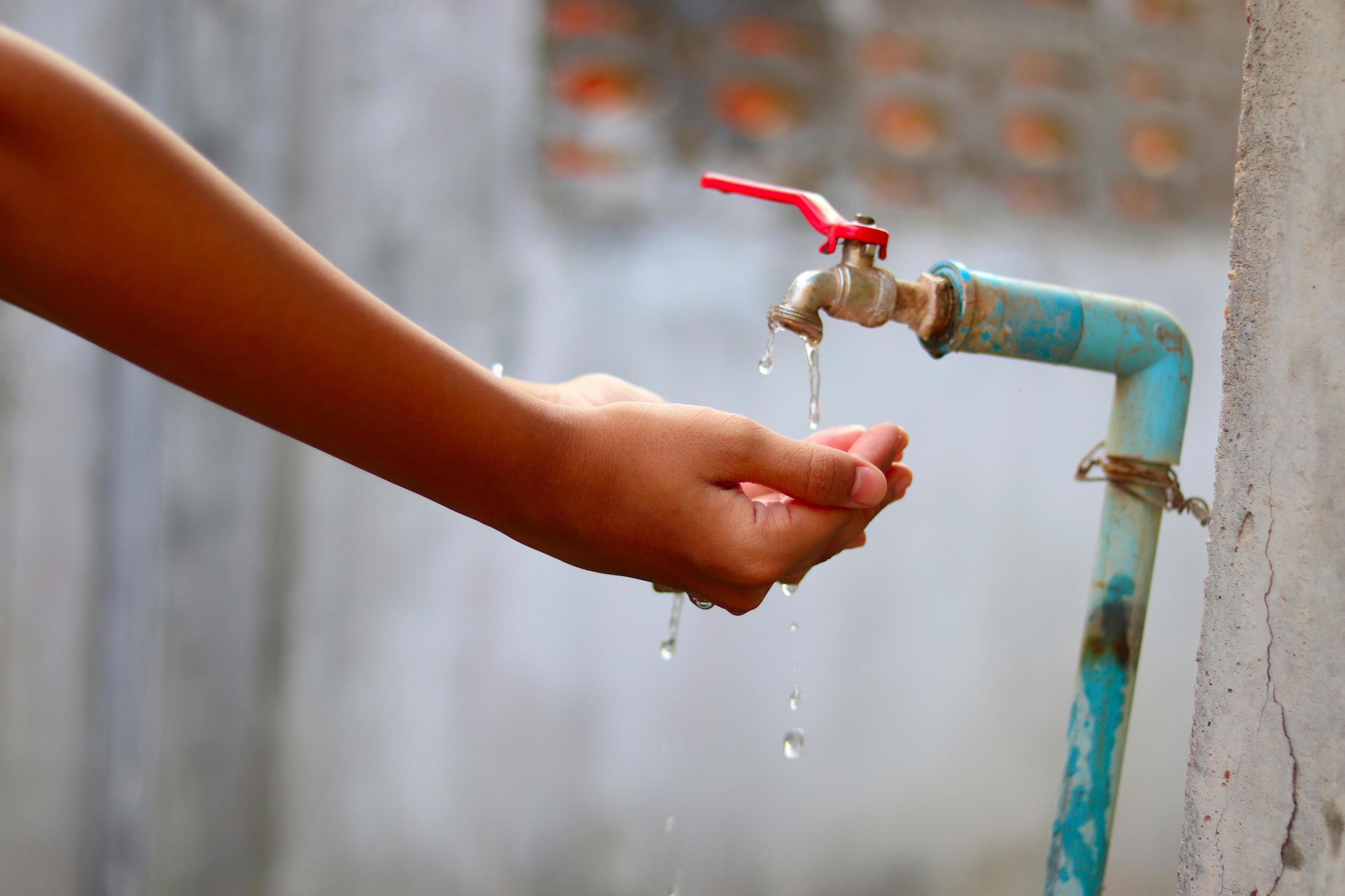 Young hands collecting water from an old tap 7196223 Stock Photo at ...