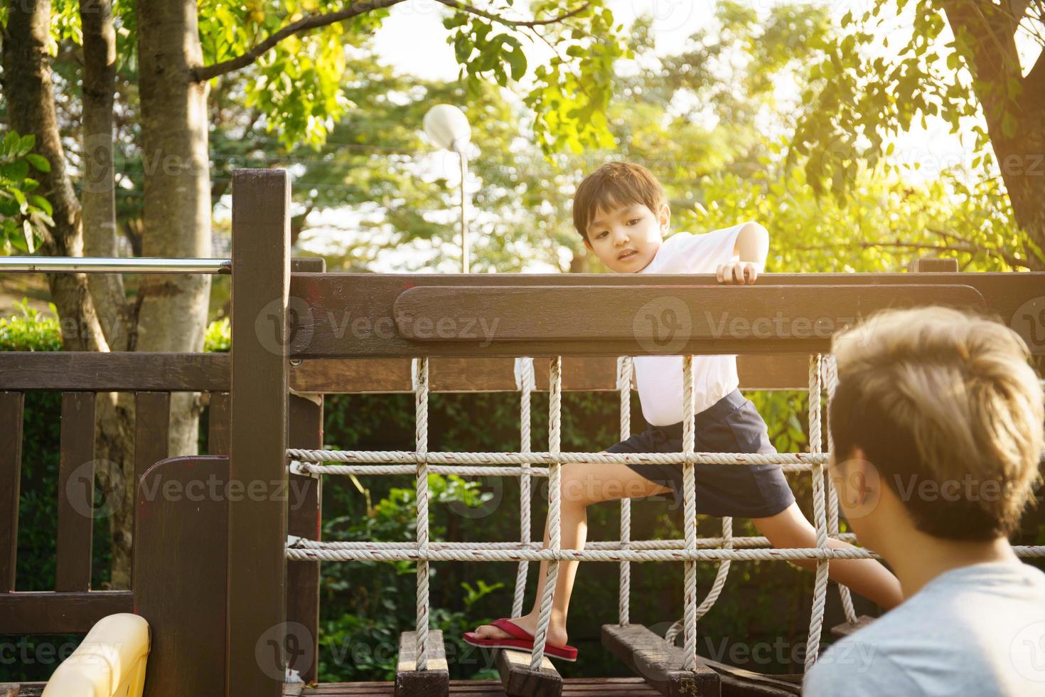 Two happy little asian kids playing outdoor in the sunny park Stock Photo -  Alamy