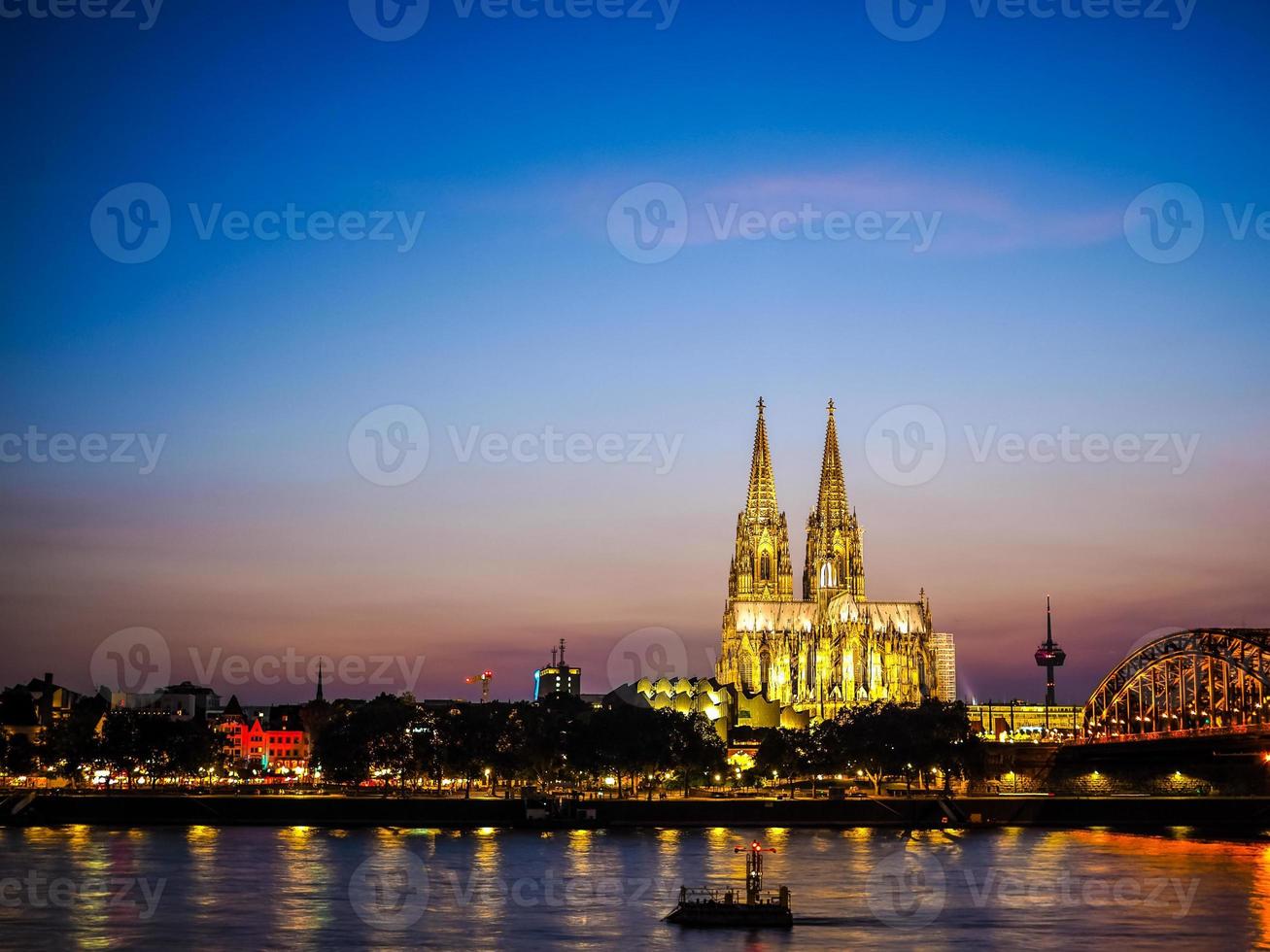 HDR St Peter Cathedral and Hohenzollern Bridge over river Rhine photo