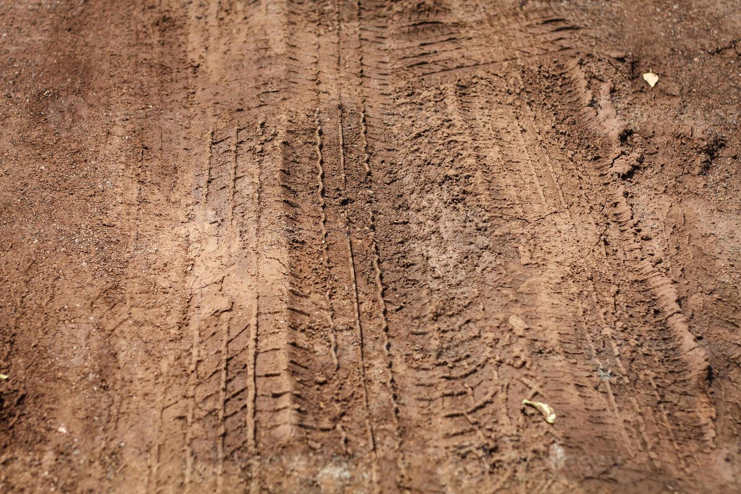 Texture of wheel track on country road photo