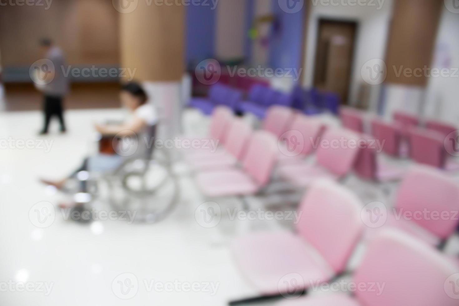 Blurred patient sitting on wheelchair waiting to see doctor photo