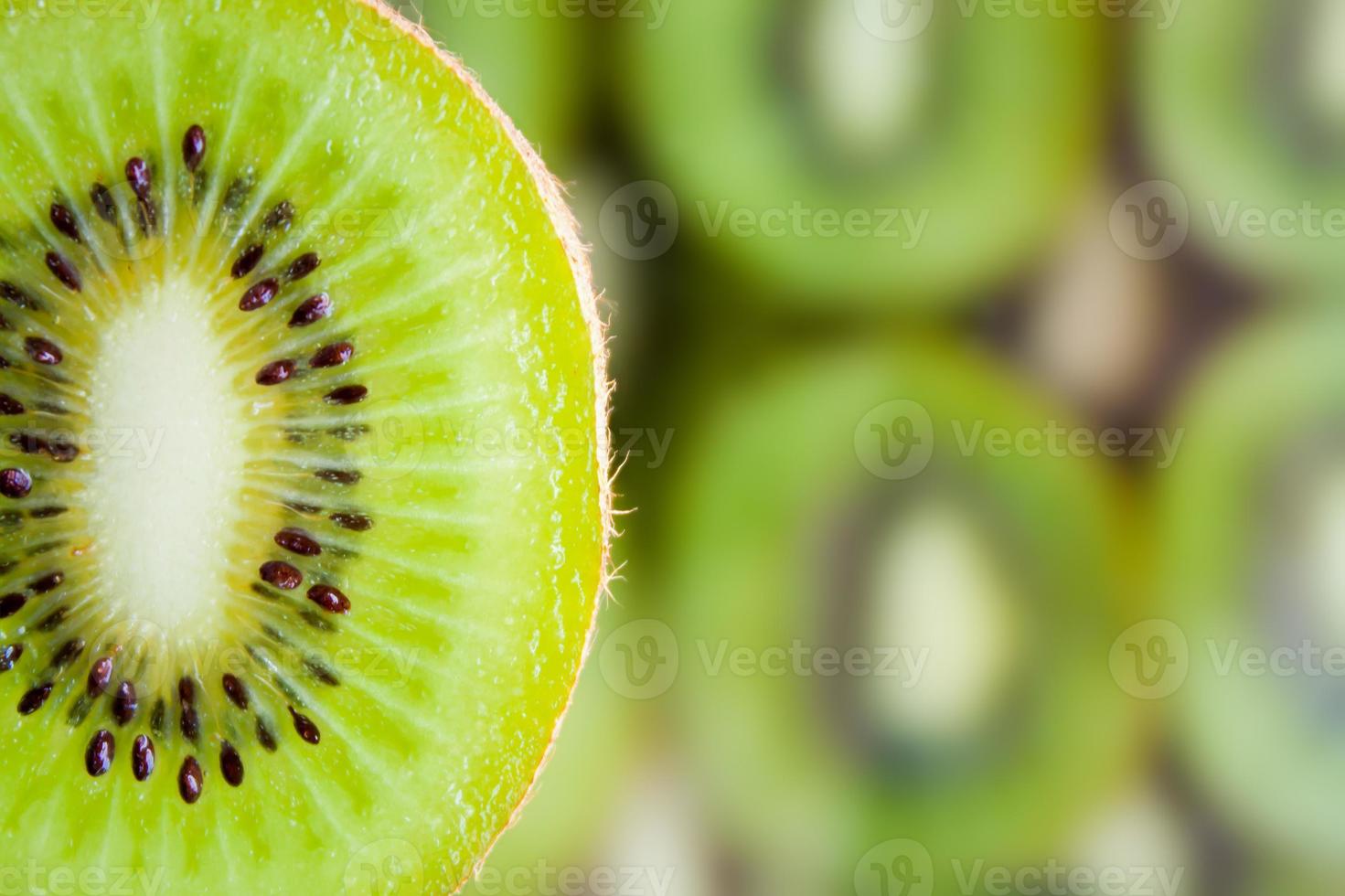 fresh kiwi fruit slice on kiwi background photo