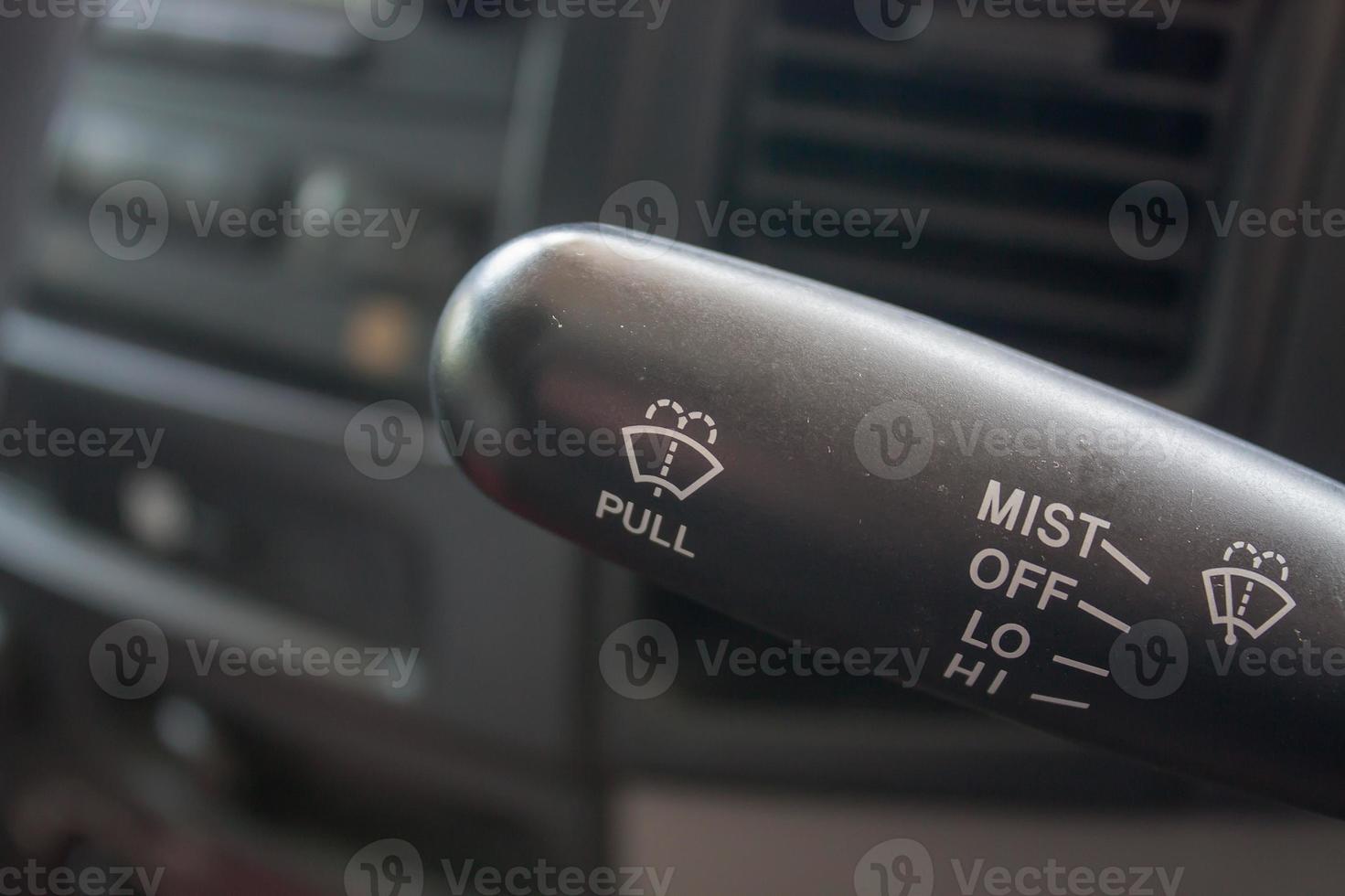 Closeup of car wiper control, modern car interior details photo