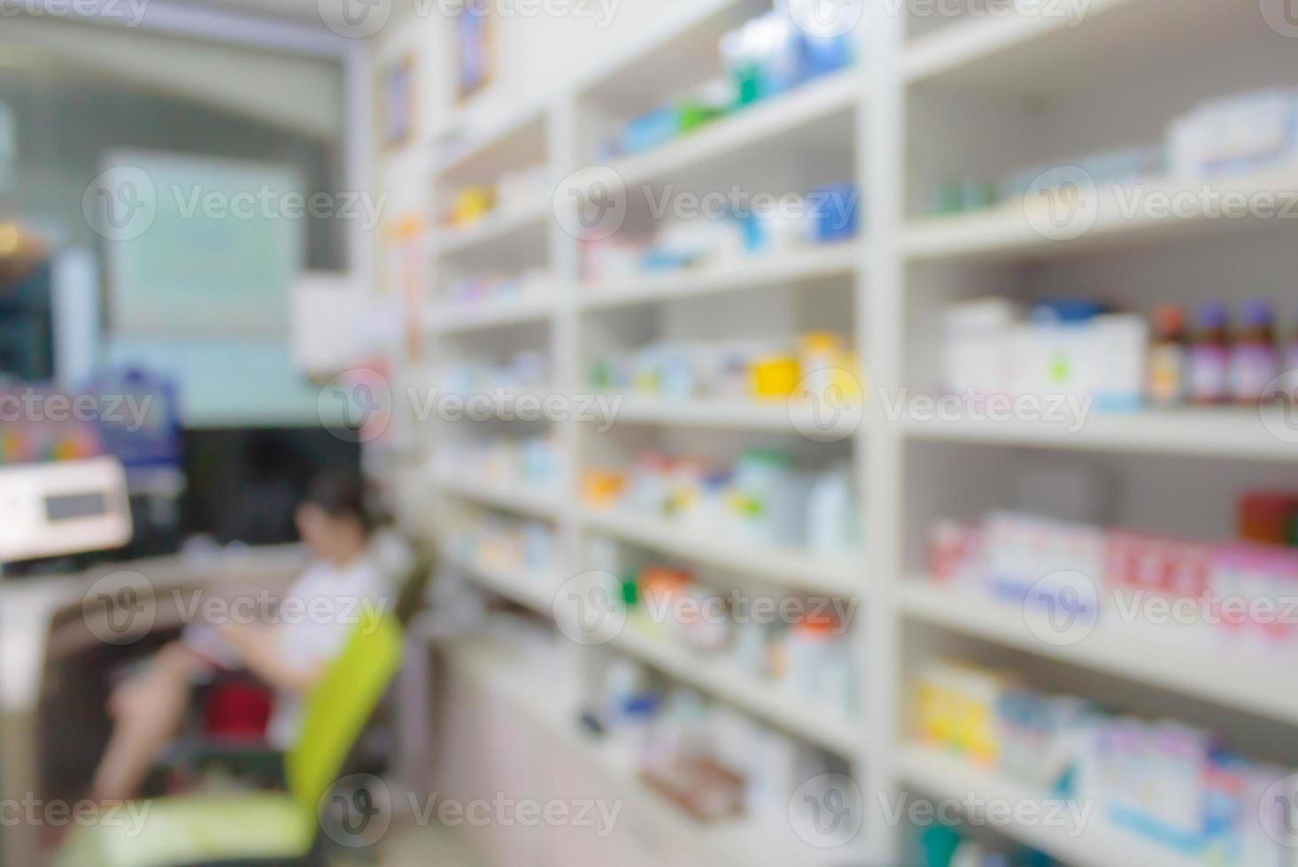 pharmacy store drugs shelves interior blurred background photo