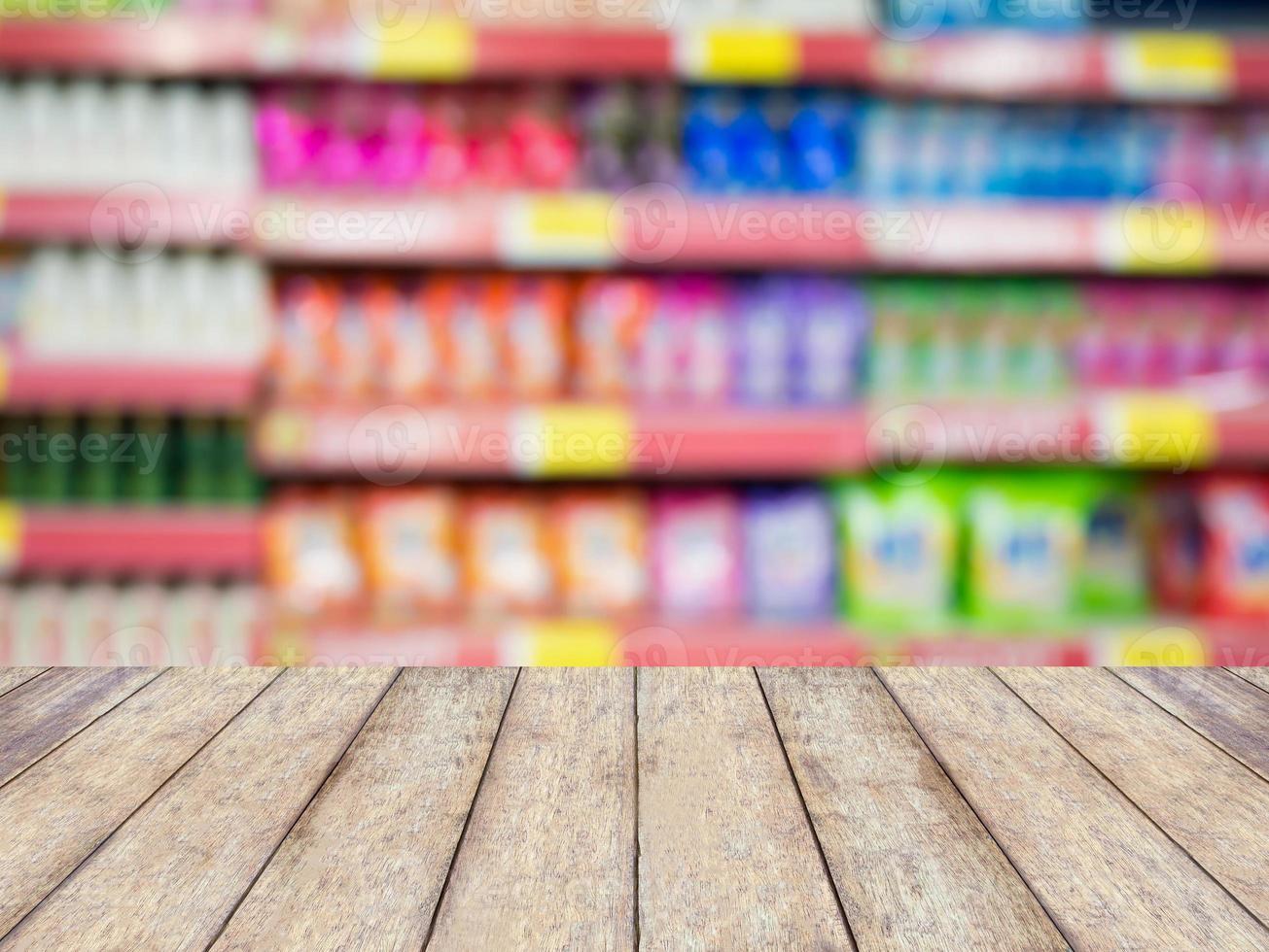 detergent shelves in supermarket or grocery store blurred background photo