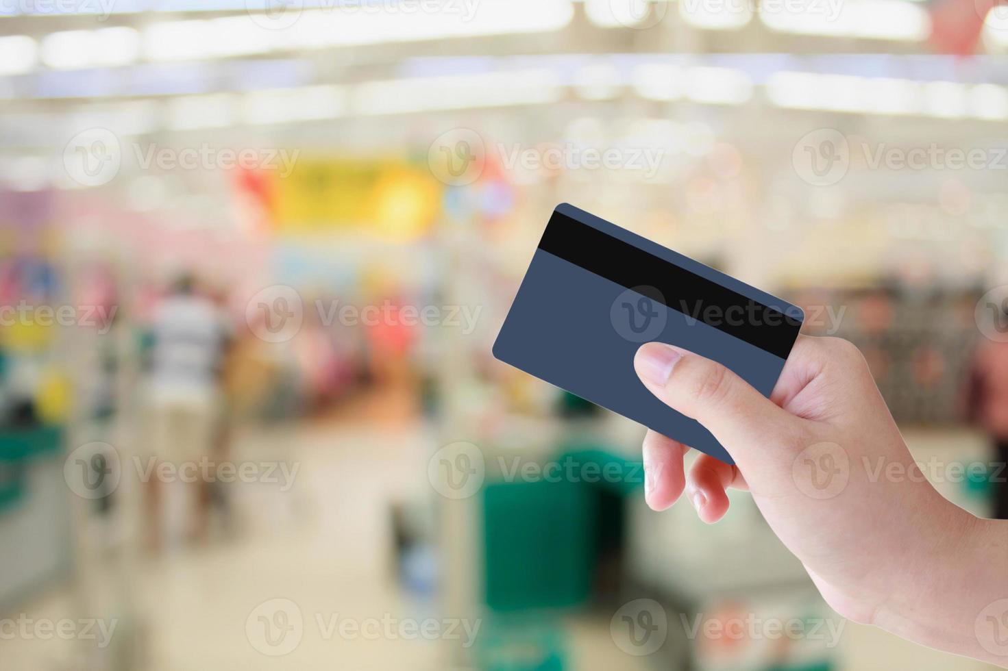 Buying with Credit Card in supermarket photo
