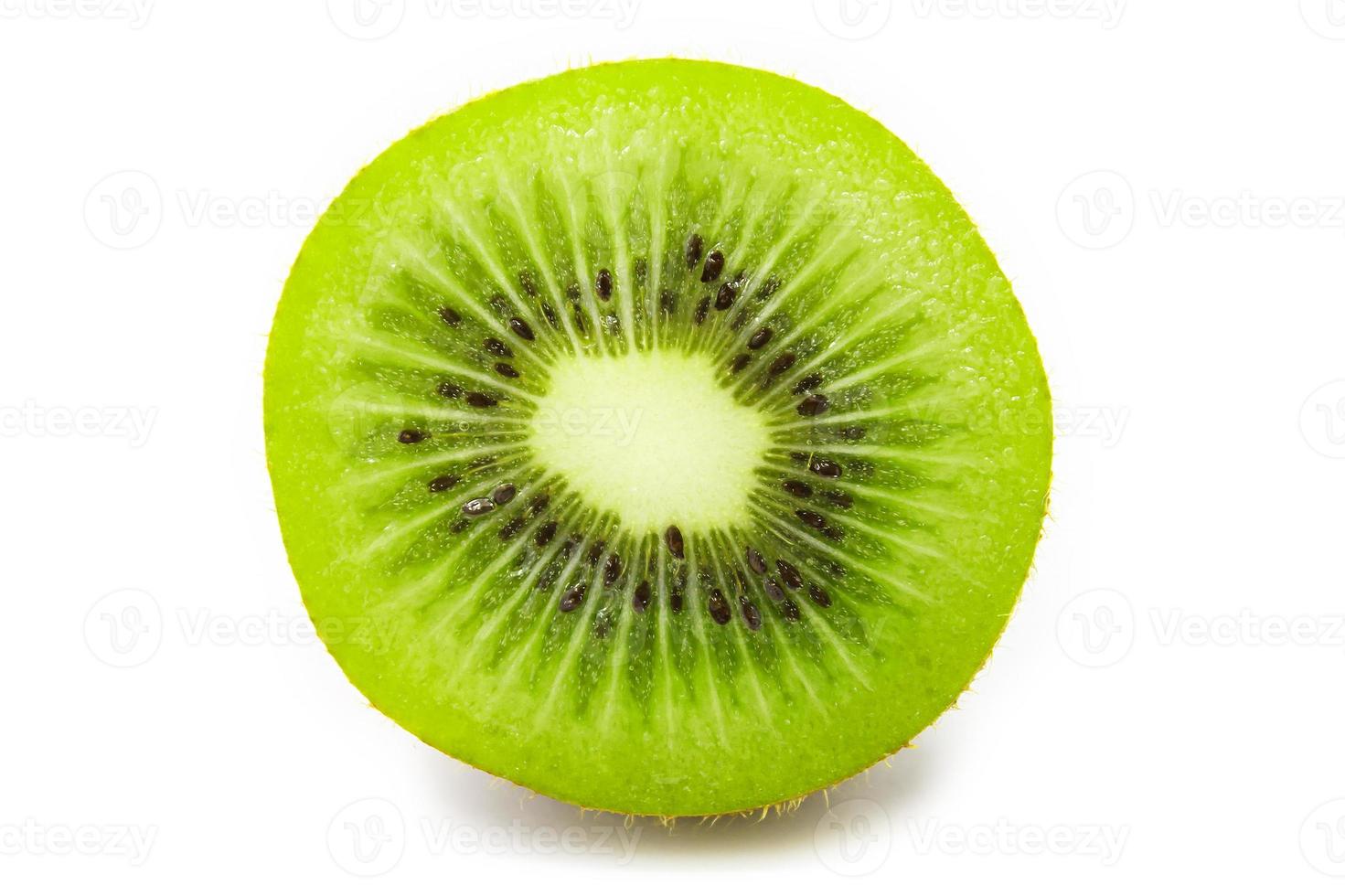 Slice of fresh kiwi fruit isolated on white background photo