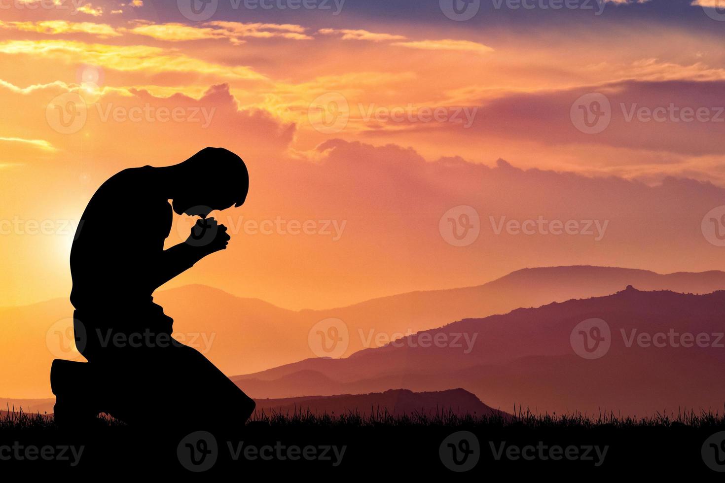 Silhouette of Christian Praying Hands Spiritual and Religious People Praying to God Christianity Concepts photo