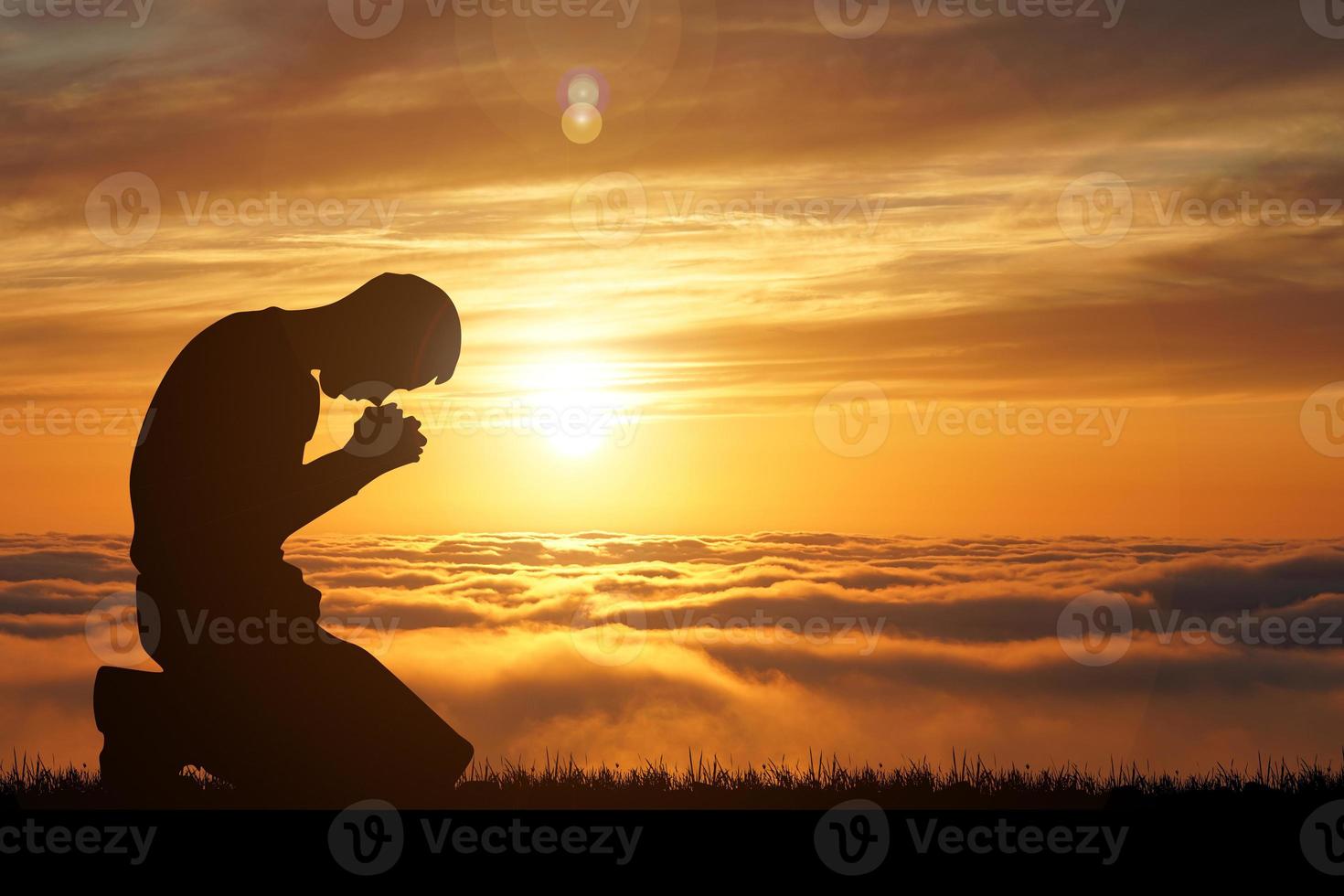 Silhouette of Christian Praying Hands Spiritual and Religious People Praying to God Christianity Concepts photo