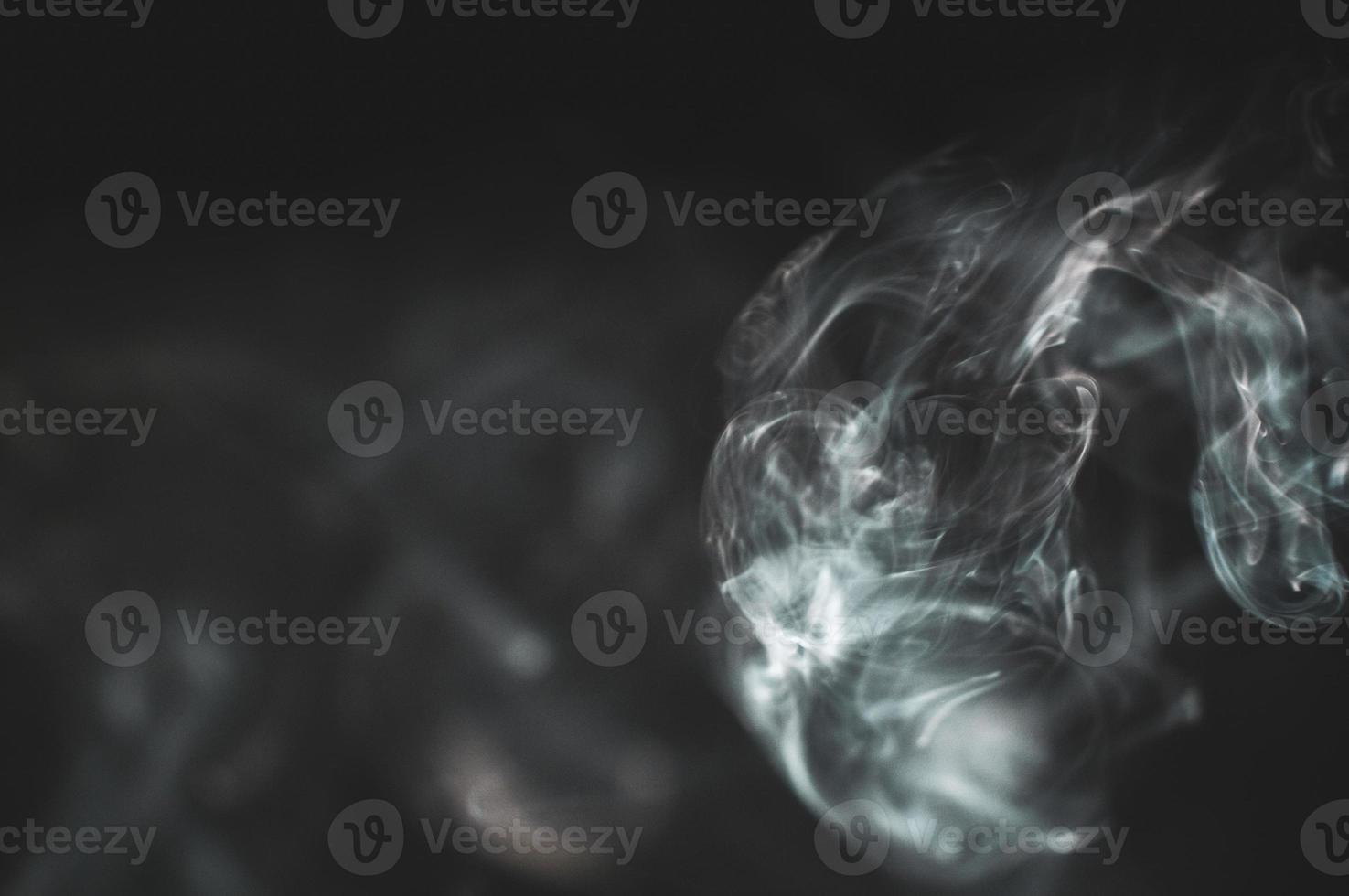 abstract background of smoke or fog on black background photo