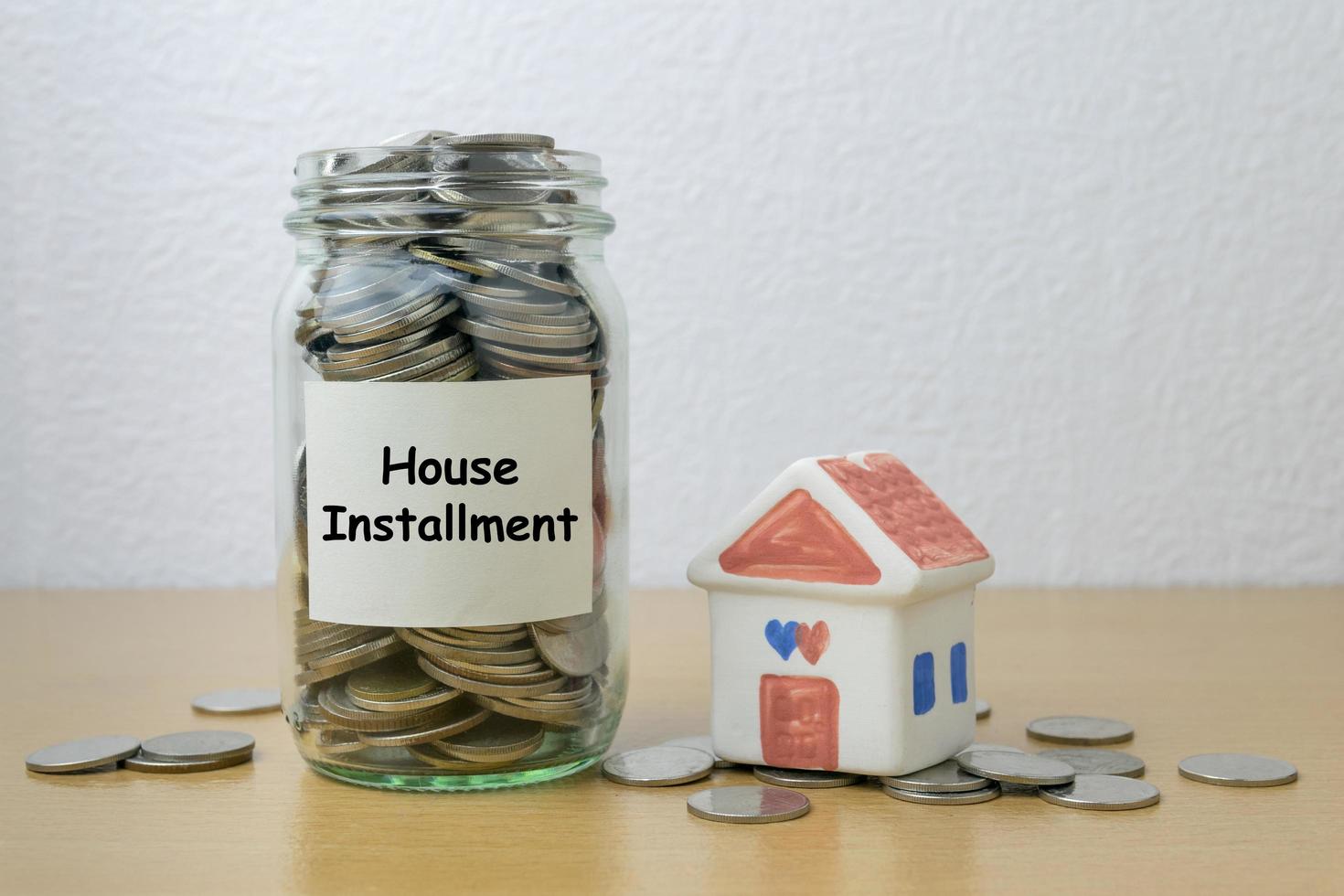 Money saving for house installment in the glass bottle photo